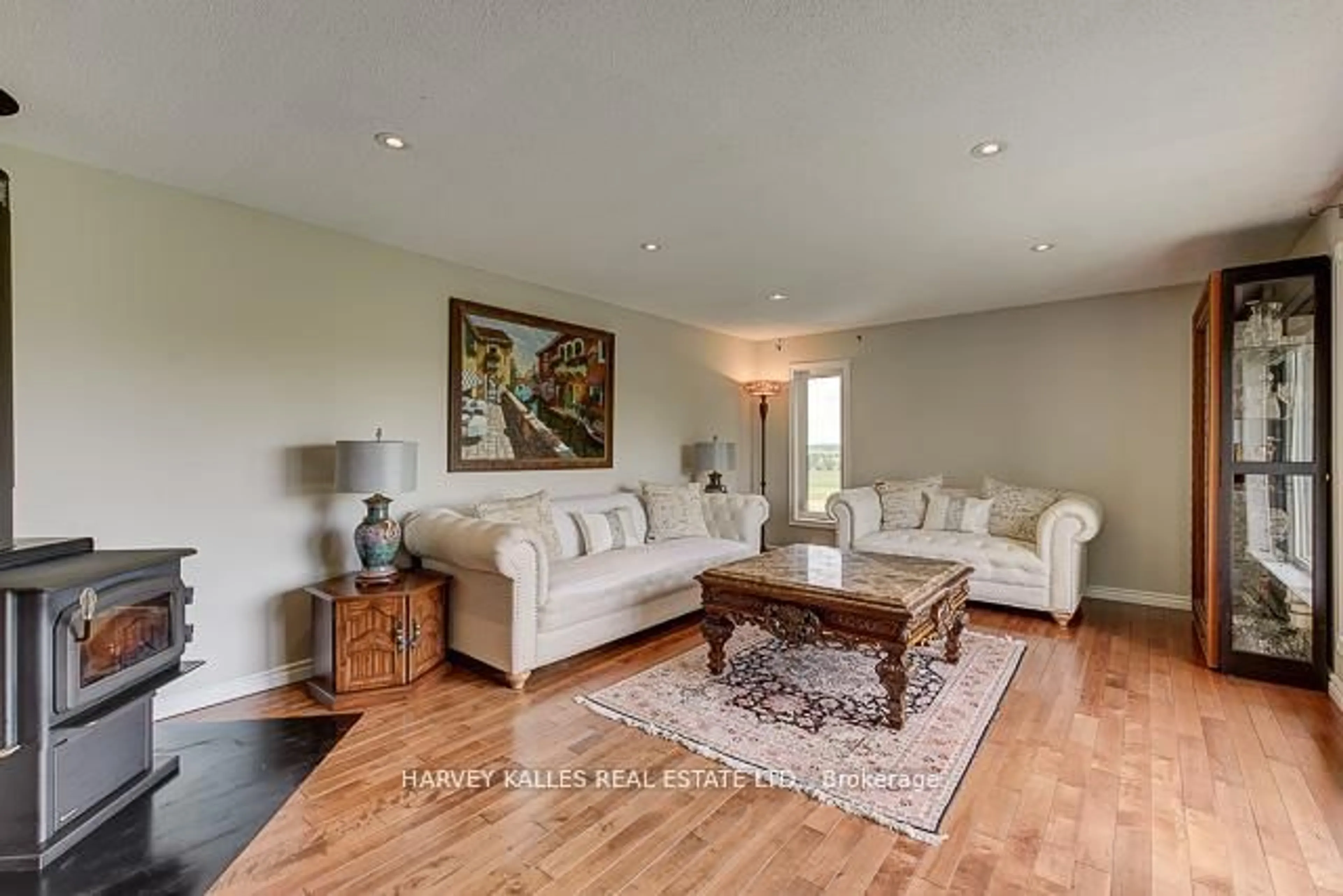 Living room with furniture, wood/laminate floor for 3327 County Rd 50, Adjala-Tosorontio Ontario L0G 1L0