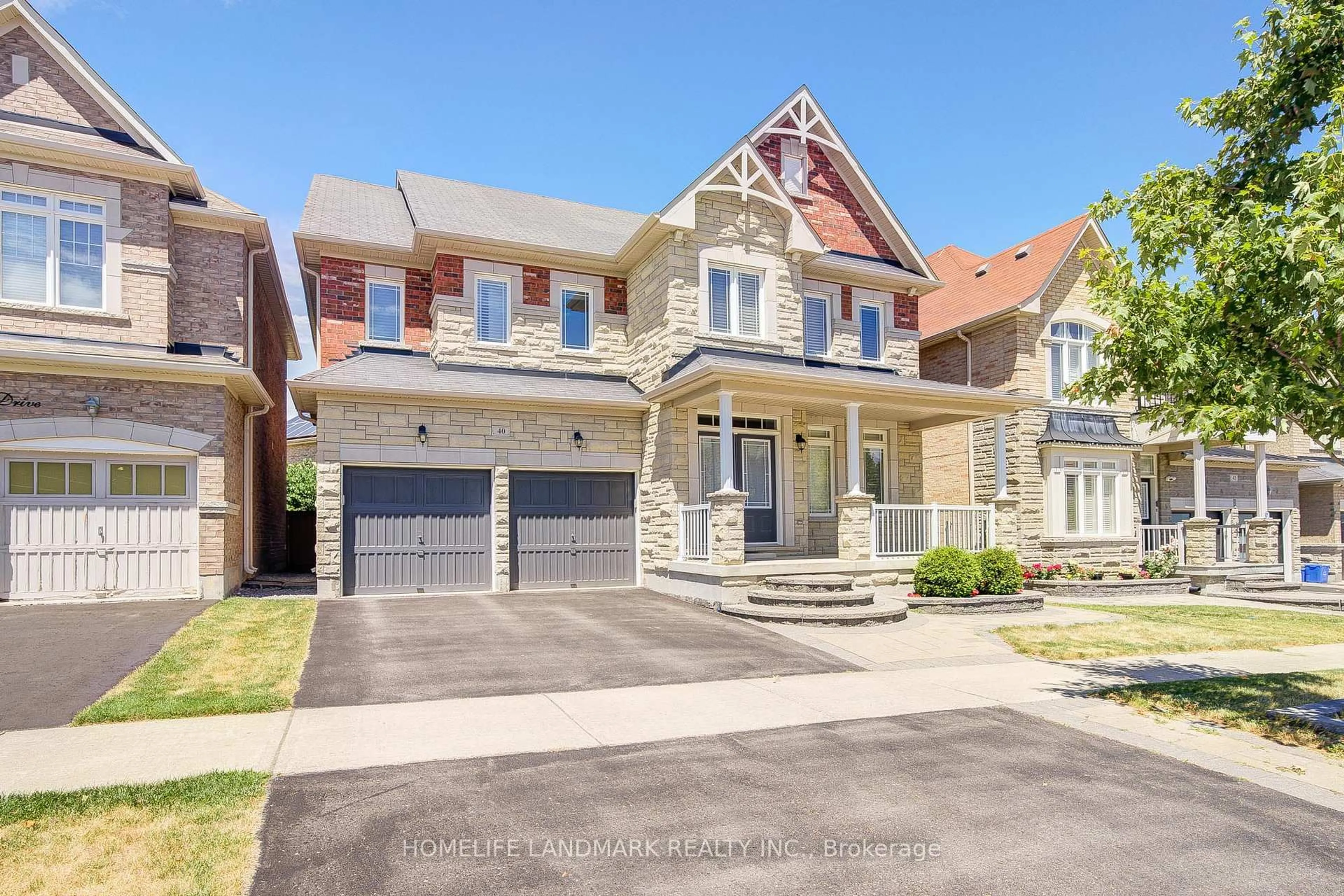 Home with brick exterior material, street for 40 Bitola Dr, Markham Ontario L6E 0M7