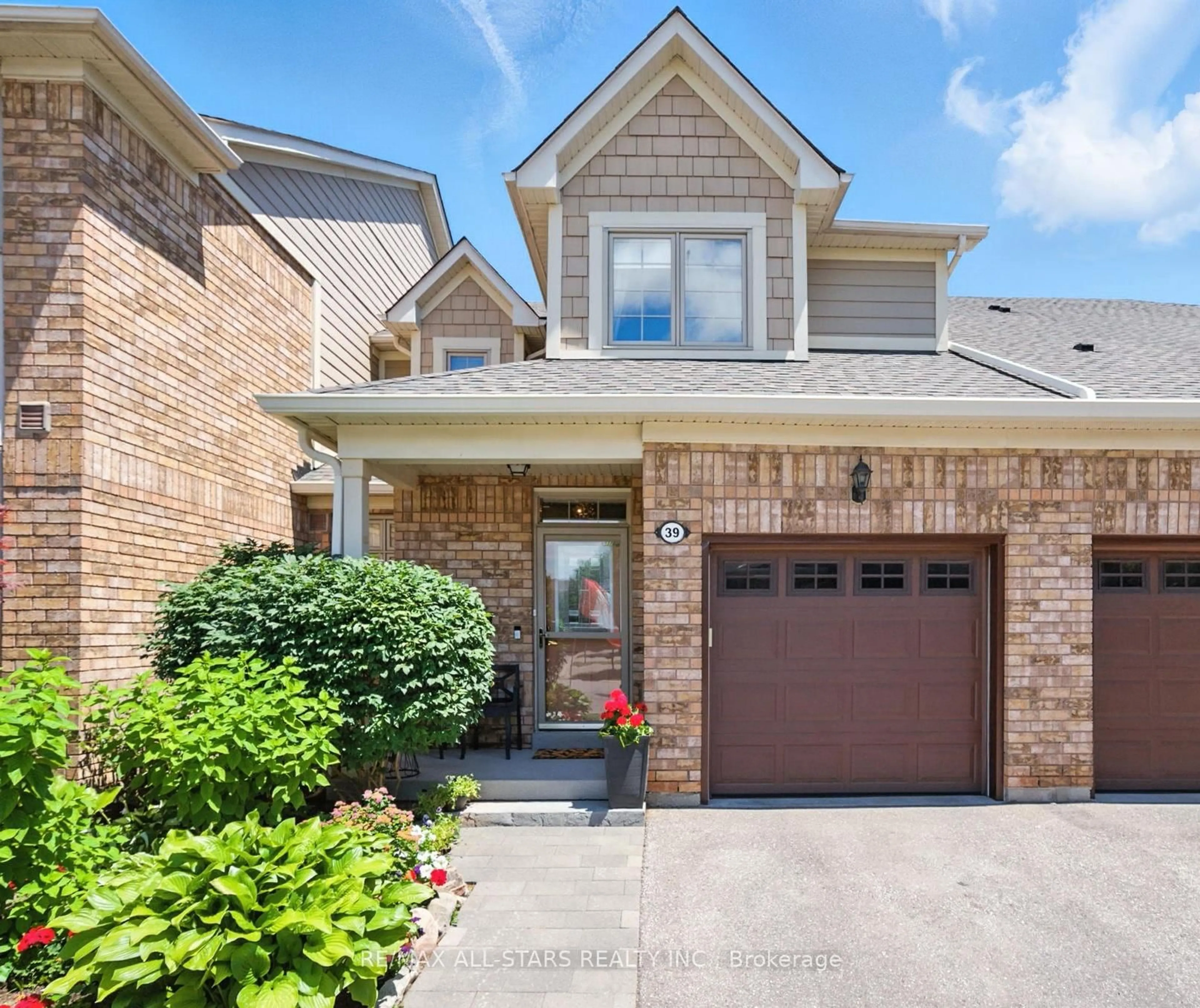 Home with brick exterior material, street for 39 Louisbourg Way, Markham Ontario L6E 2A2