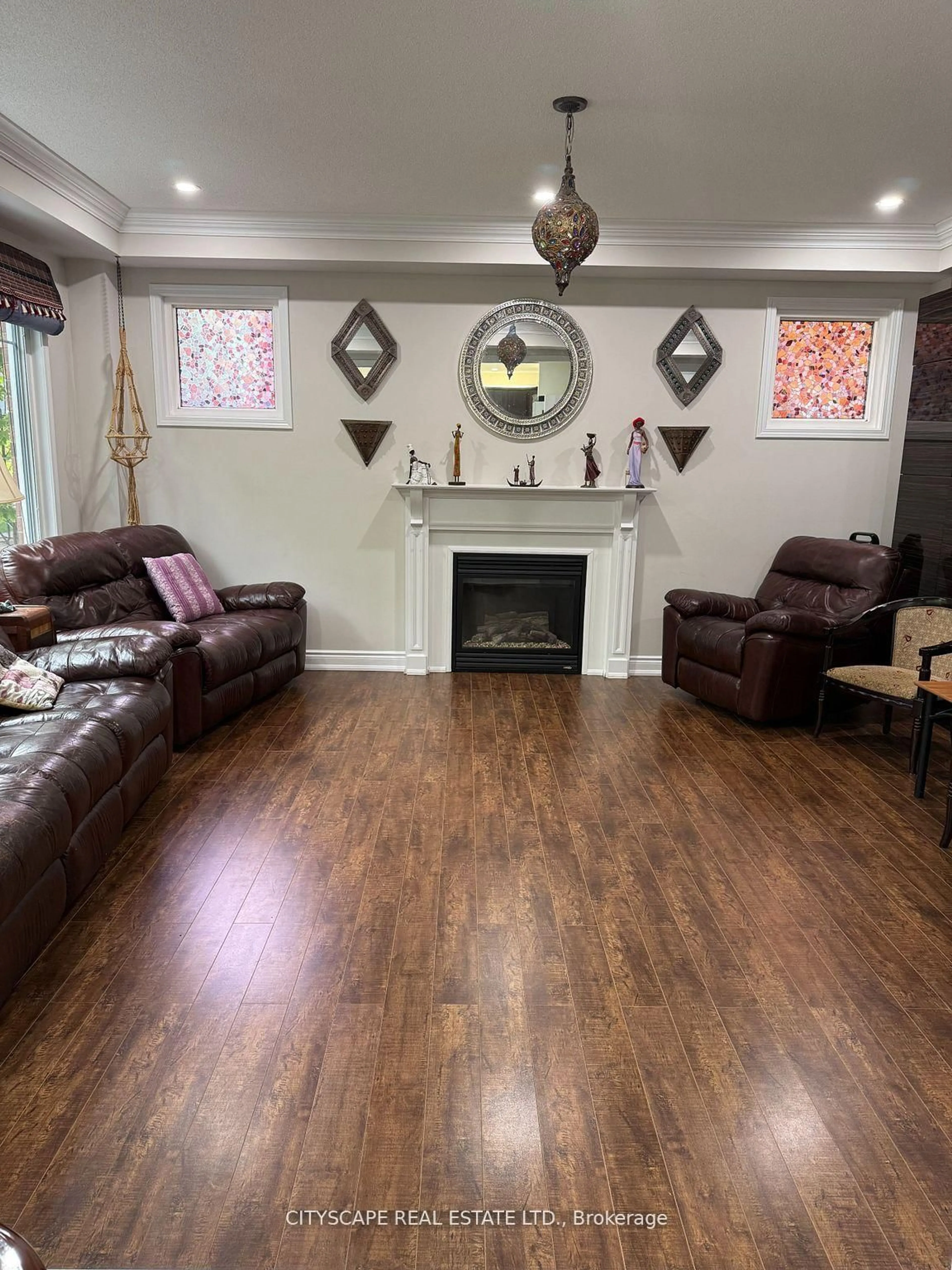 Living room with furniture, wood/laminate floor for 77 Bulmer Cres, Newmarket Ontario L3X 3K1