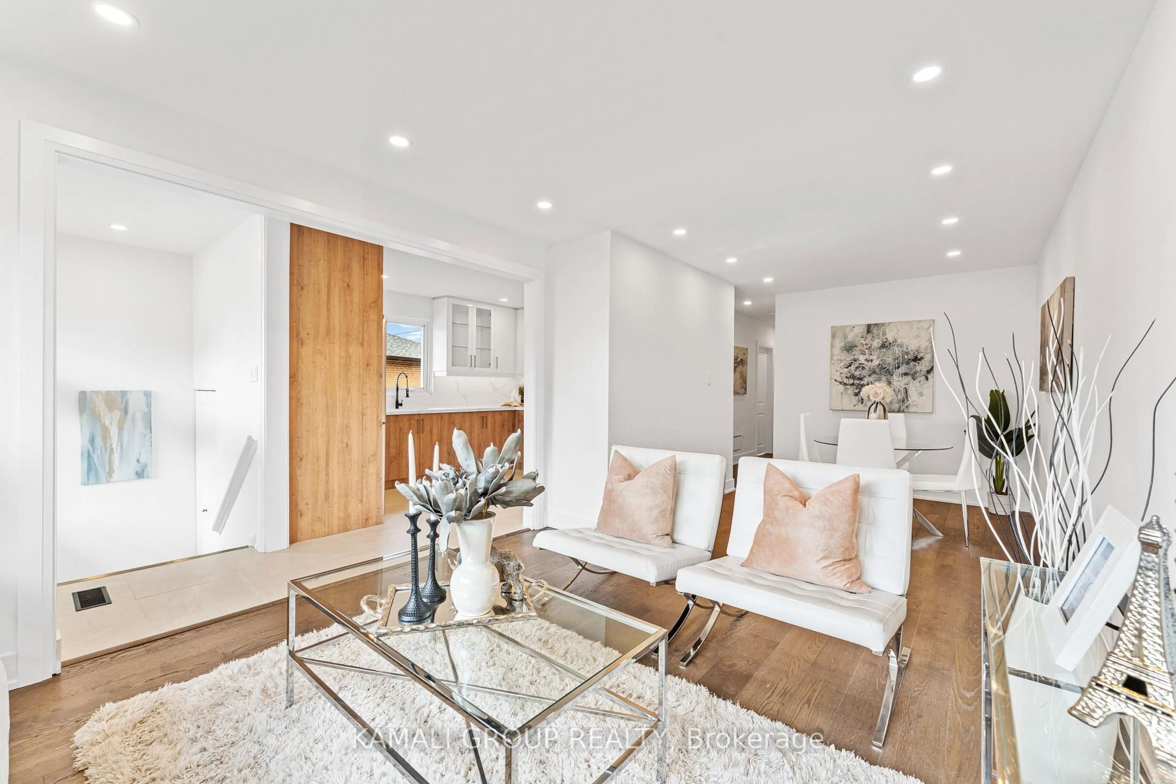 Living room with furniture, wood/laminate floor for 83 Walter Ave, Newmarket Ontario L3Y 2T5
