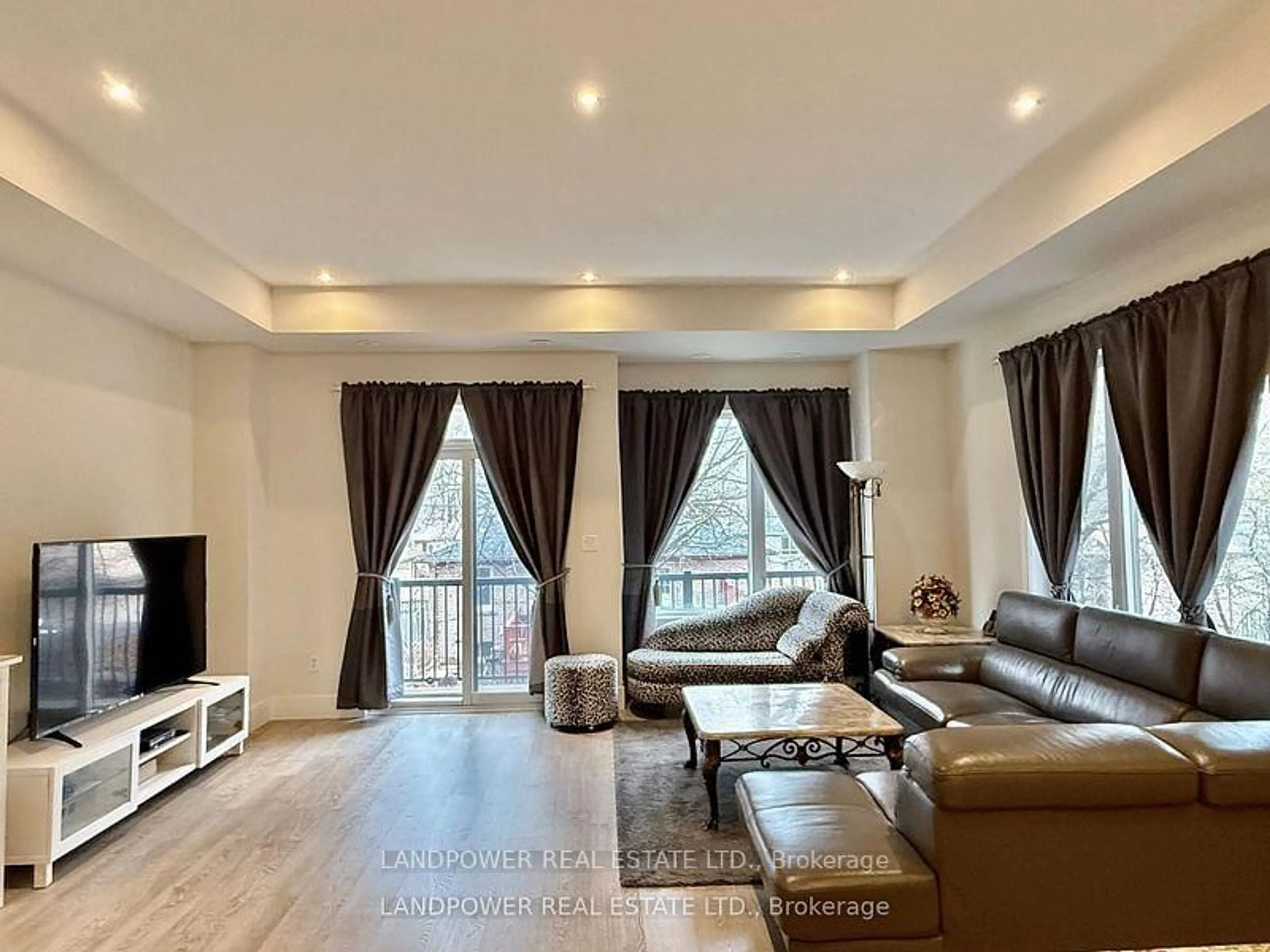 Living room with furniture, wood/laminate floor for 49 Ambler Lane, Richmond Hill Ontario L4C 0Z8