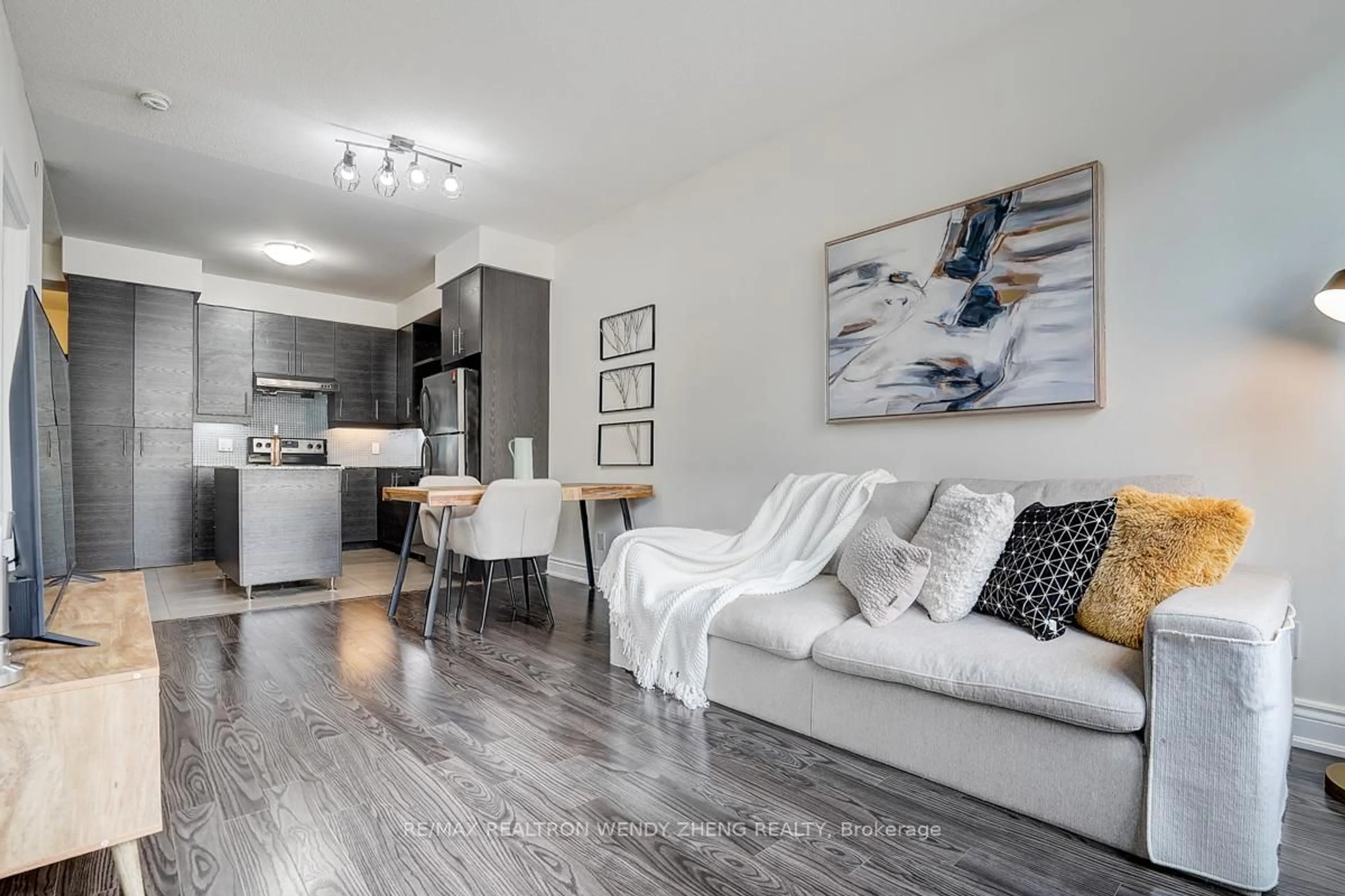 Living room with furniture, wood/laminate floor for 277 South Park Rd #201, Markham Ontario L3T 0B7