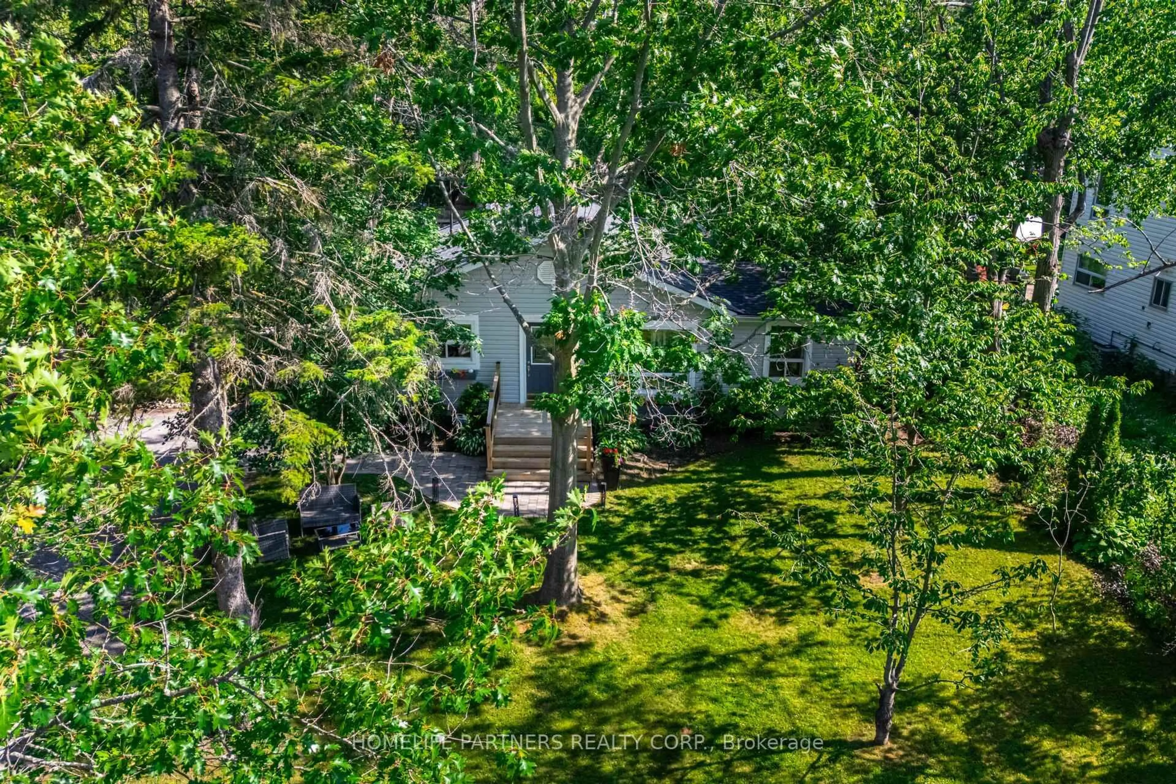 A pic from outside/outdoor area/front of a property/back of a property/a pic from drone, forest/trees view for 749 Happy Vale Dr, Innisfil Ontario L9S 2E6