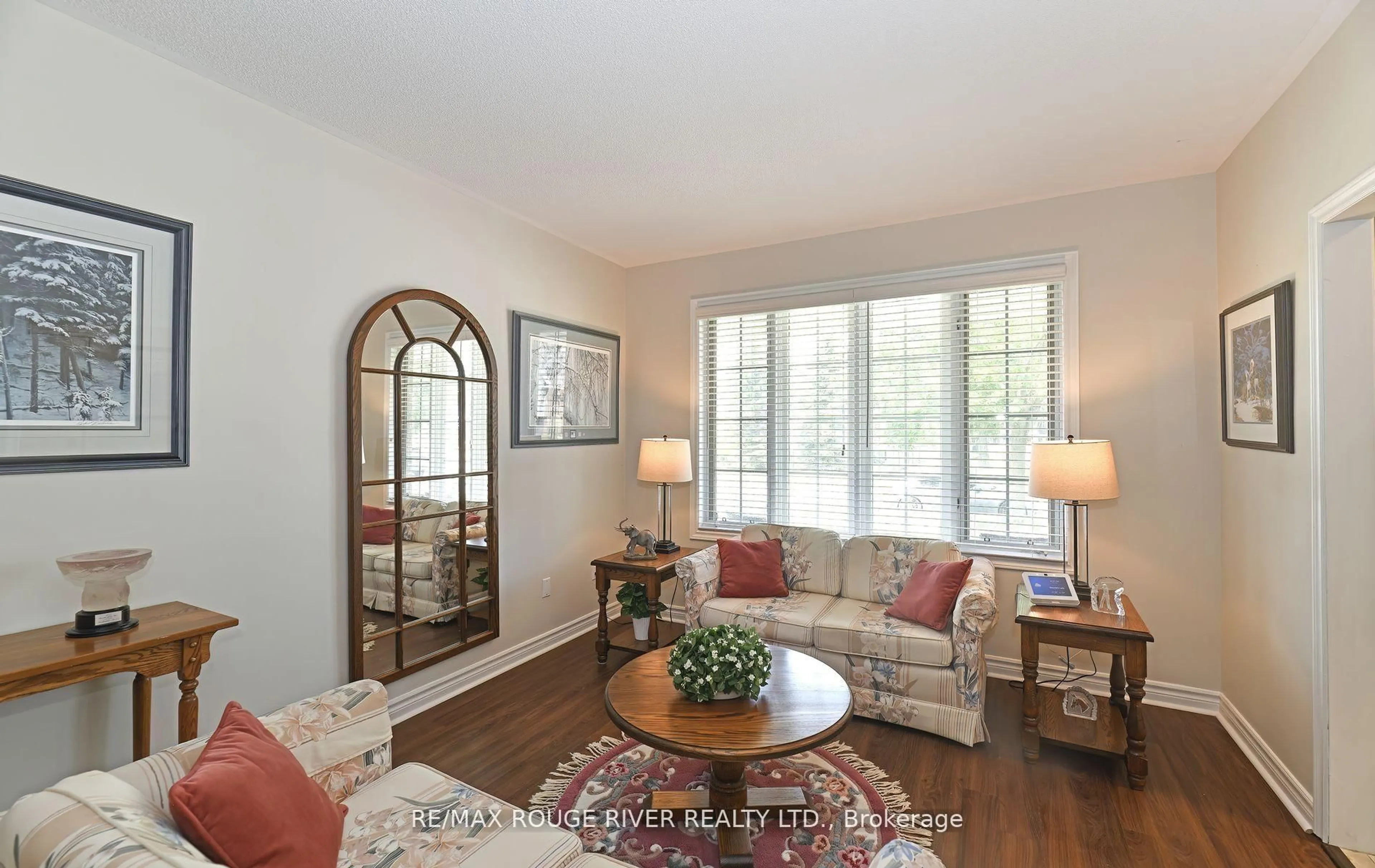 Living room with furniture, wood/laminate floor for 48 Enzo Cres, Uxbridge Ontario L9P 1M1
