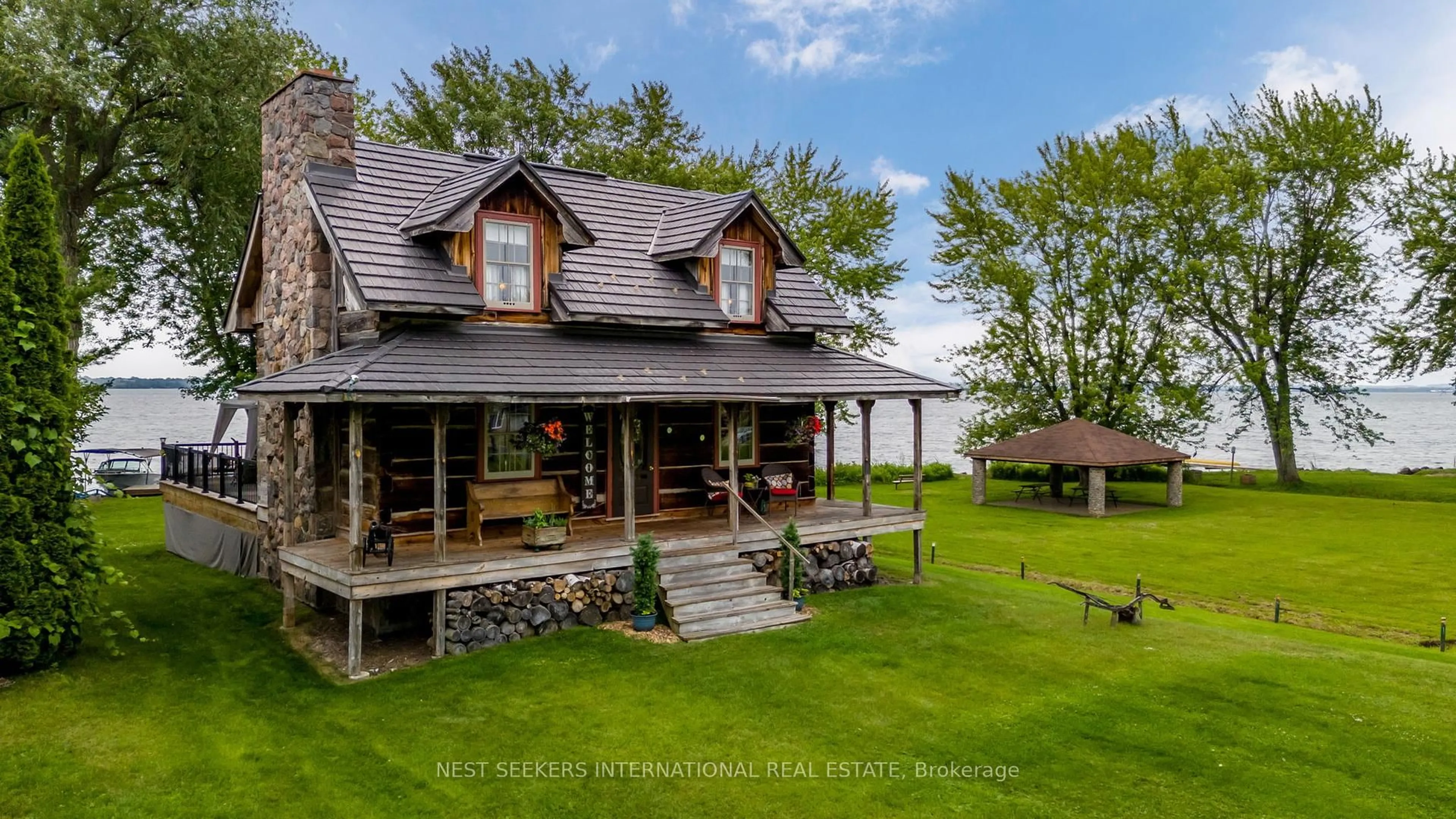 A pic from outside/outdoor area/front of a property/back of a property/a pic from drone, water/lake/river/ocean view for 219 Bayshore Rd, Innisfil Ontario L0L 1K0