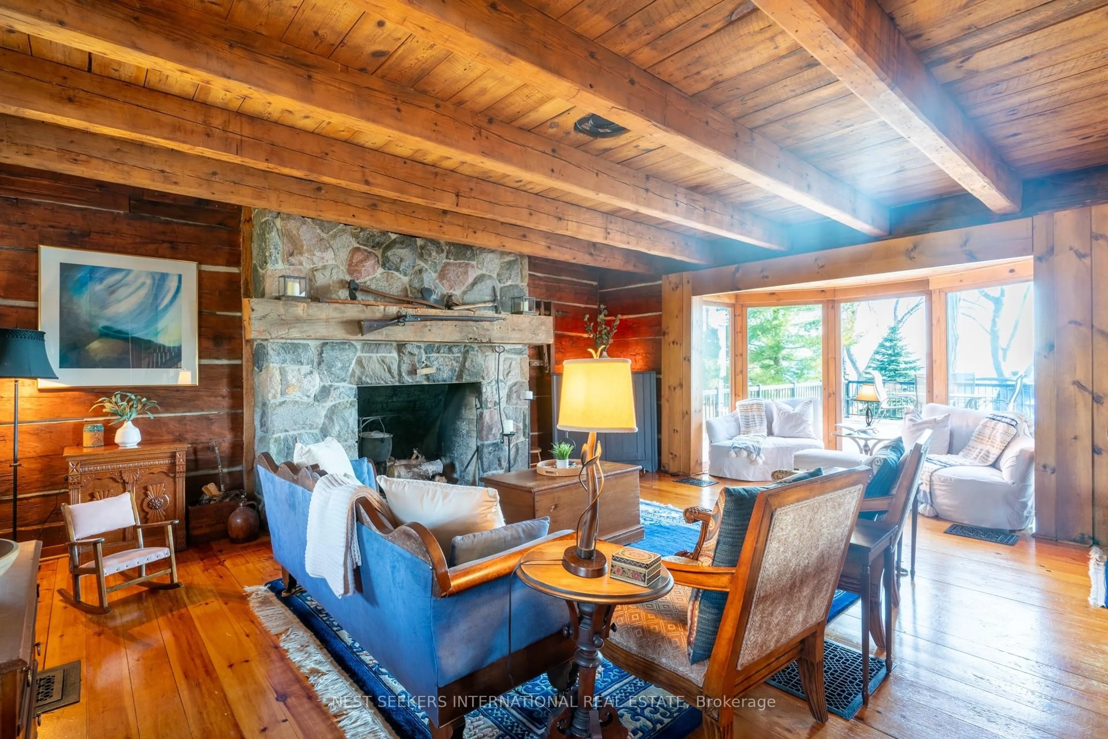 Living room with furniture, wood/laminate floor for 219 Bayshore Rd, Innisfil Ontario L0L 1K0