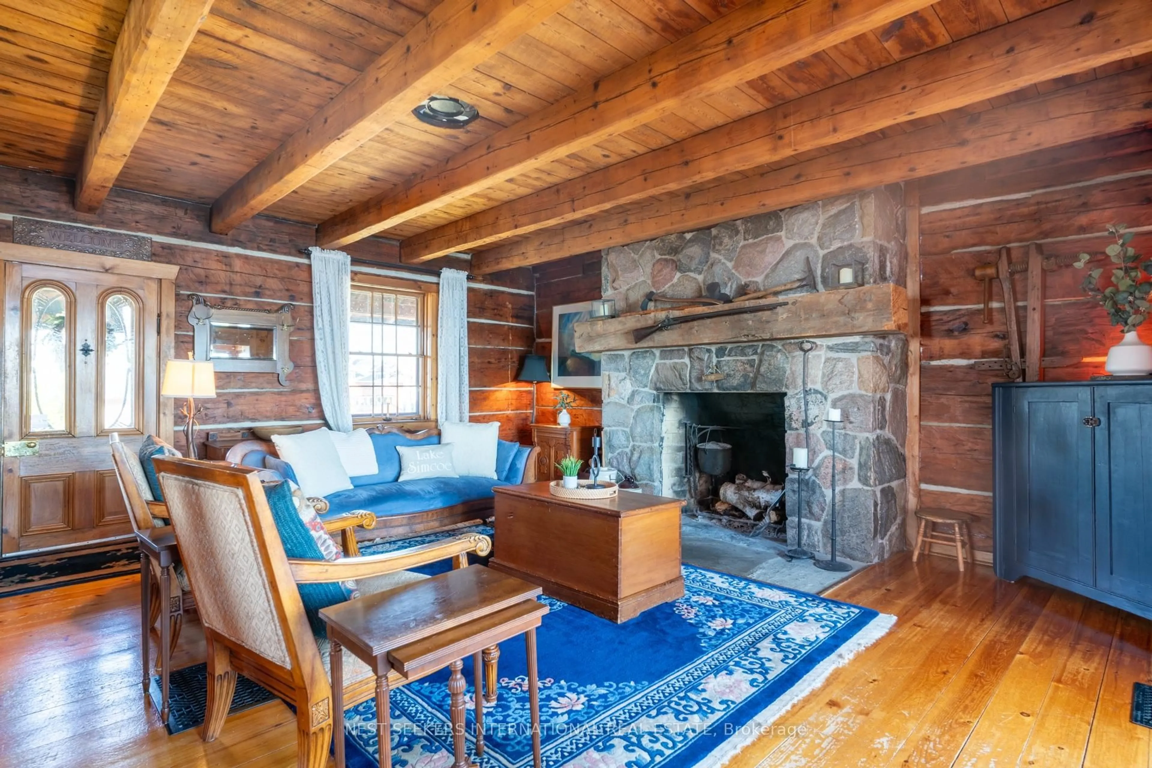 Living room with furniture, wood/laminate floor for 219 Bayshore Rd, Innisfil Ontario L0L 1K0