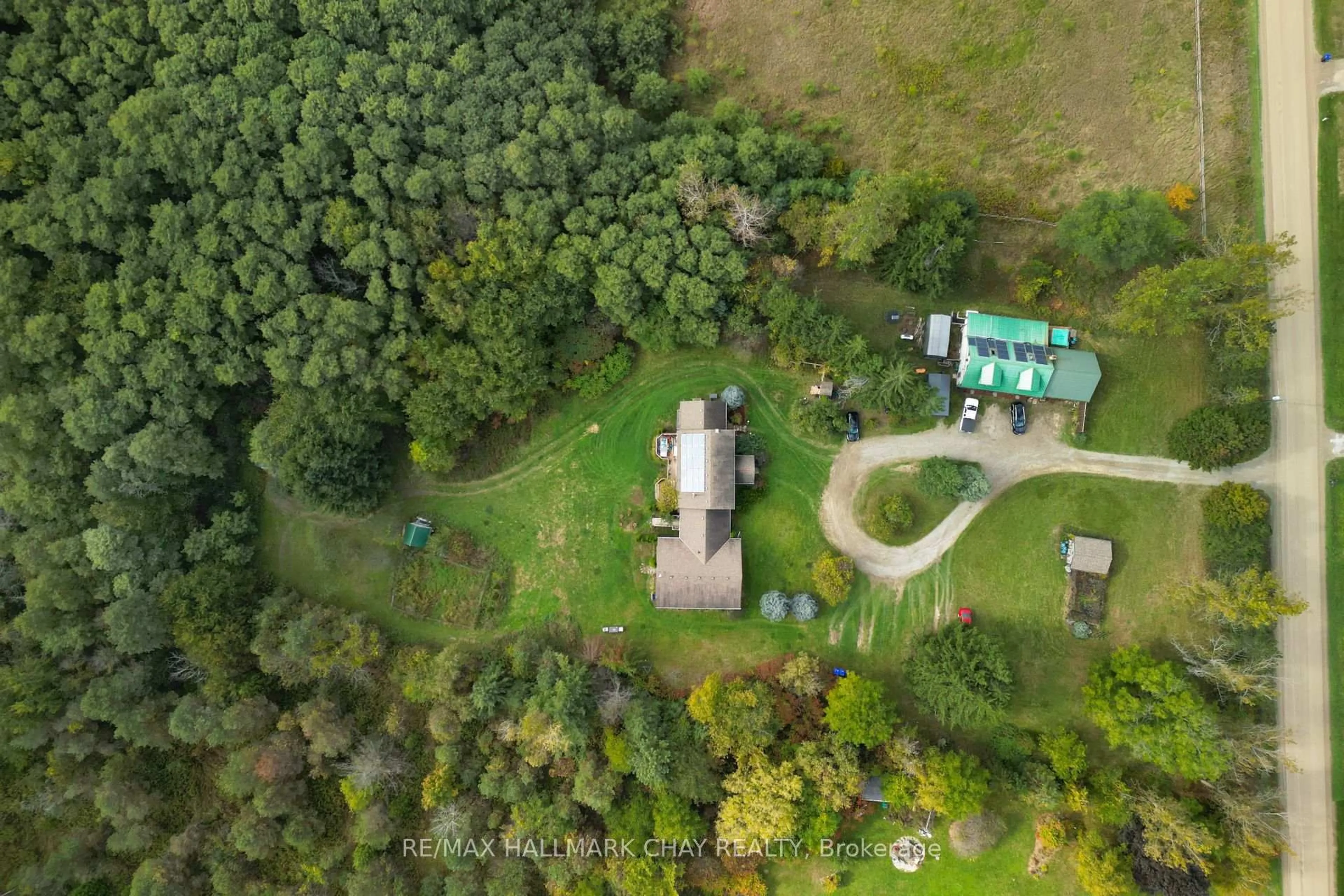 A pic from outside/outdoor area/front of a property/back of a property/a pic from drone, forest/trees view for 6509 13th Line, New Tecumseth Ontario L9R 1V4