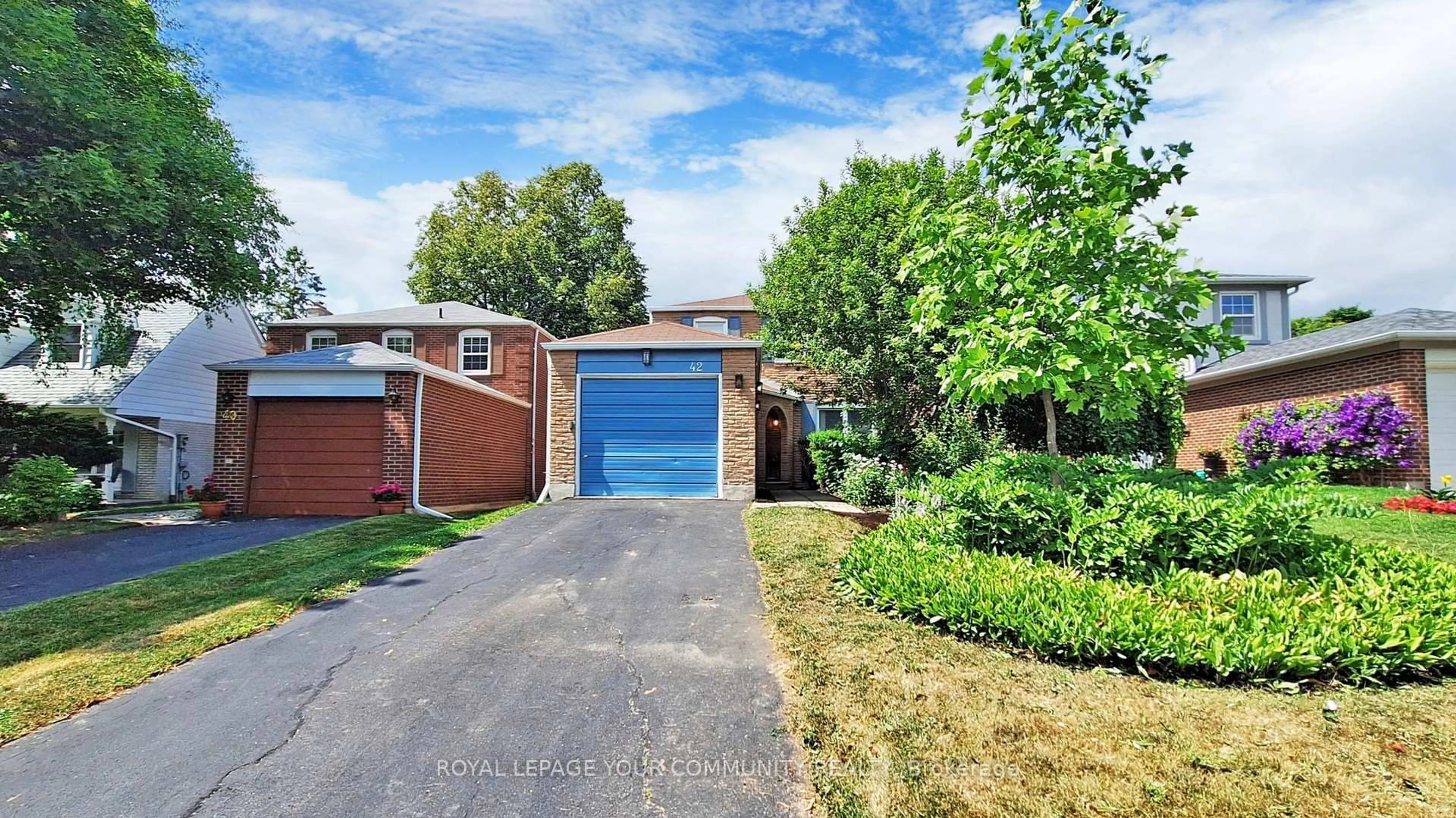 Home with brick exterior material, street for 42 Holsworthy Cres, Markham Ontario L3T 4C6
