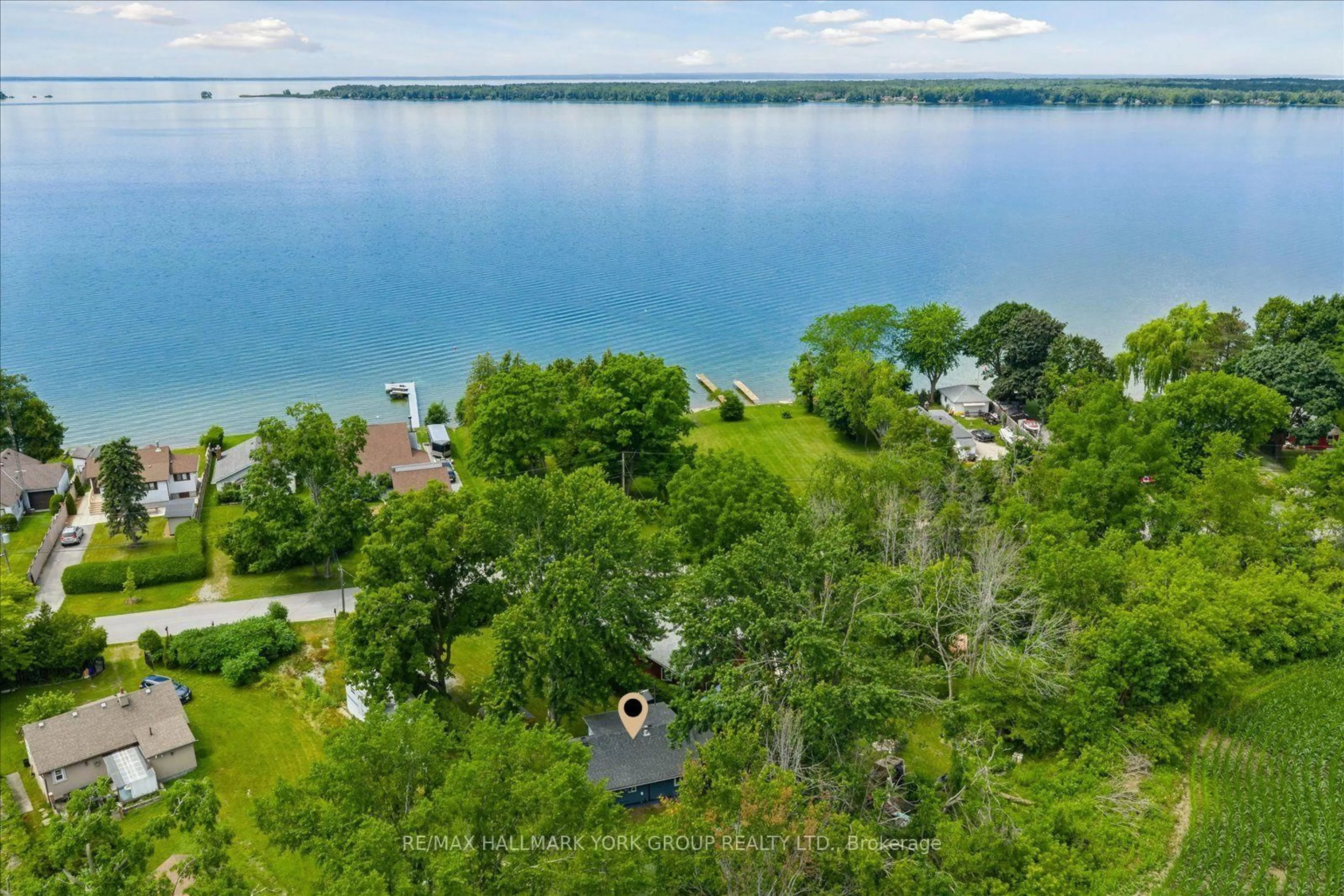 A pic from outside/outdoor area/front of a property/back of a property/a pic from drone, water/lake/river/ocean view for 77 Blue Heron Dr, Georgina Ontario L0E 1N0