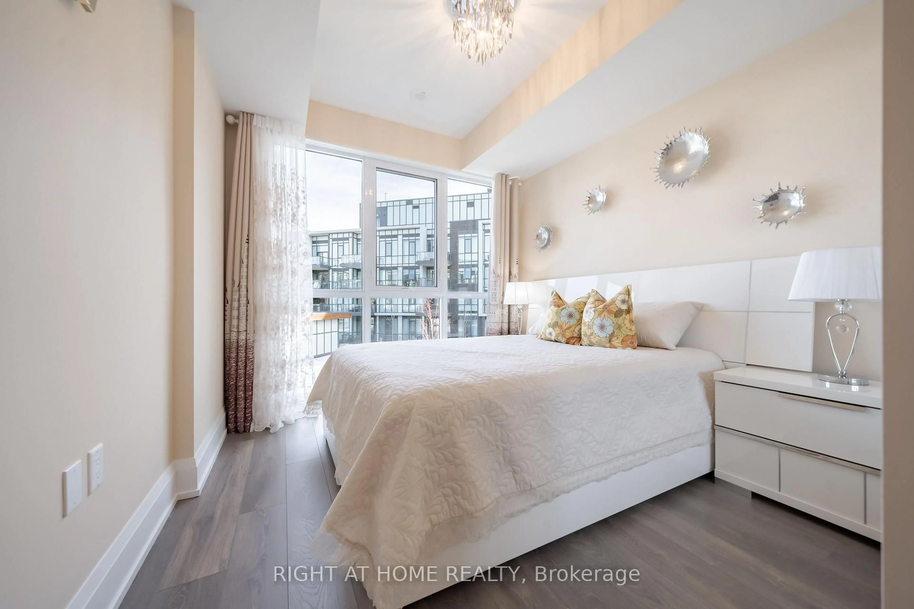 Bedroom with bed, wood/laminate floor for 415 Sea Ray Ave #202, Innisfil Ontario L9S 0R5