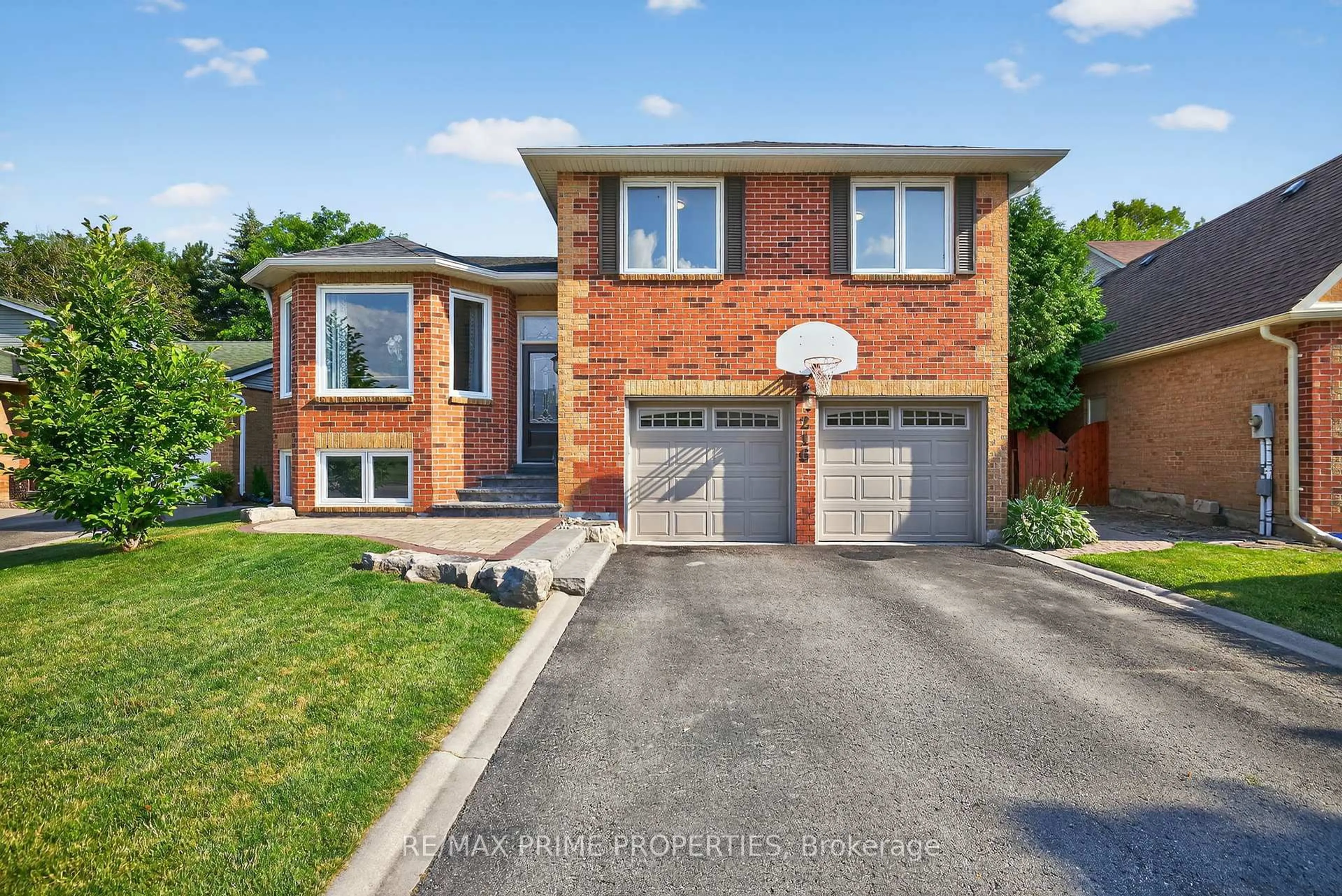 Home with brick exterior material, street for 216 Crossland Gate, Newmarket Ontario L3X 1A9