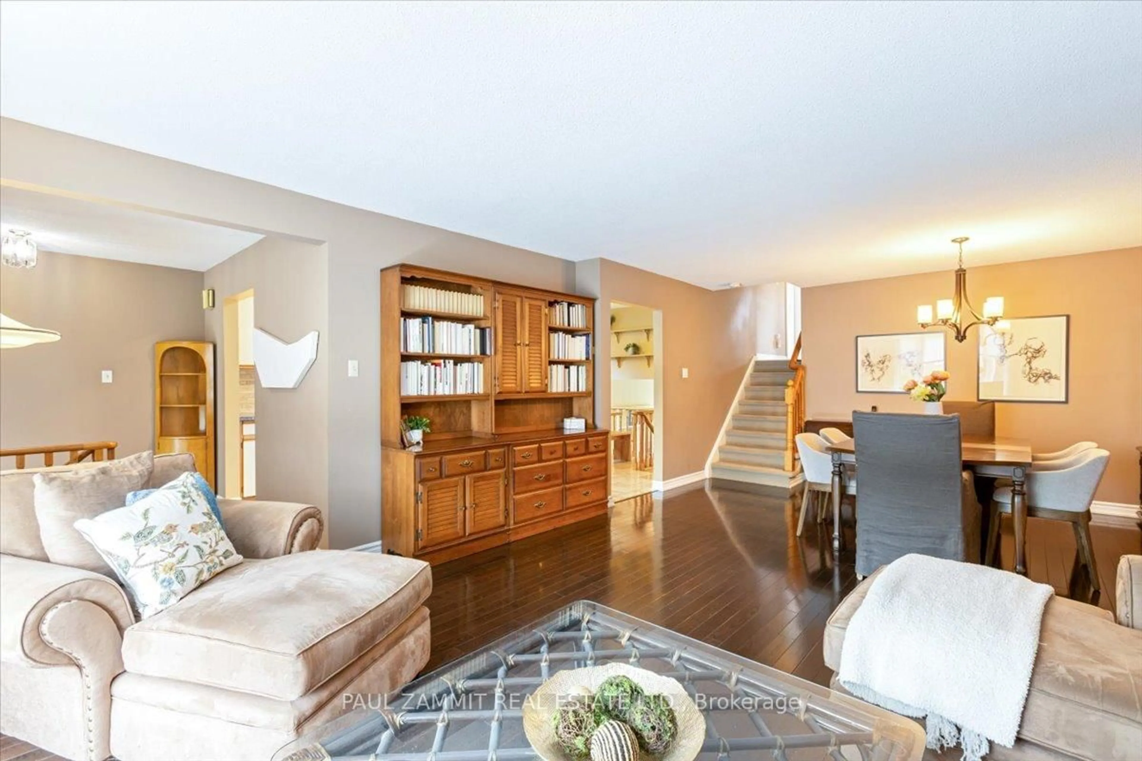 Living room with furniture, wood/laminate floor for 25 Hoover Dr, Markham Ontario L3T 5M6