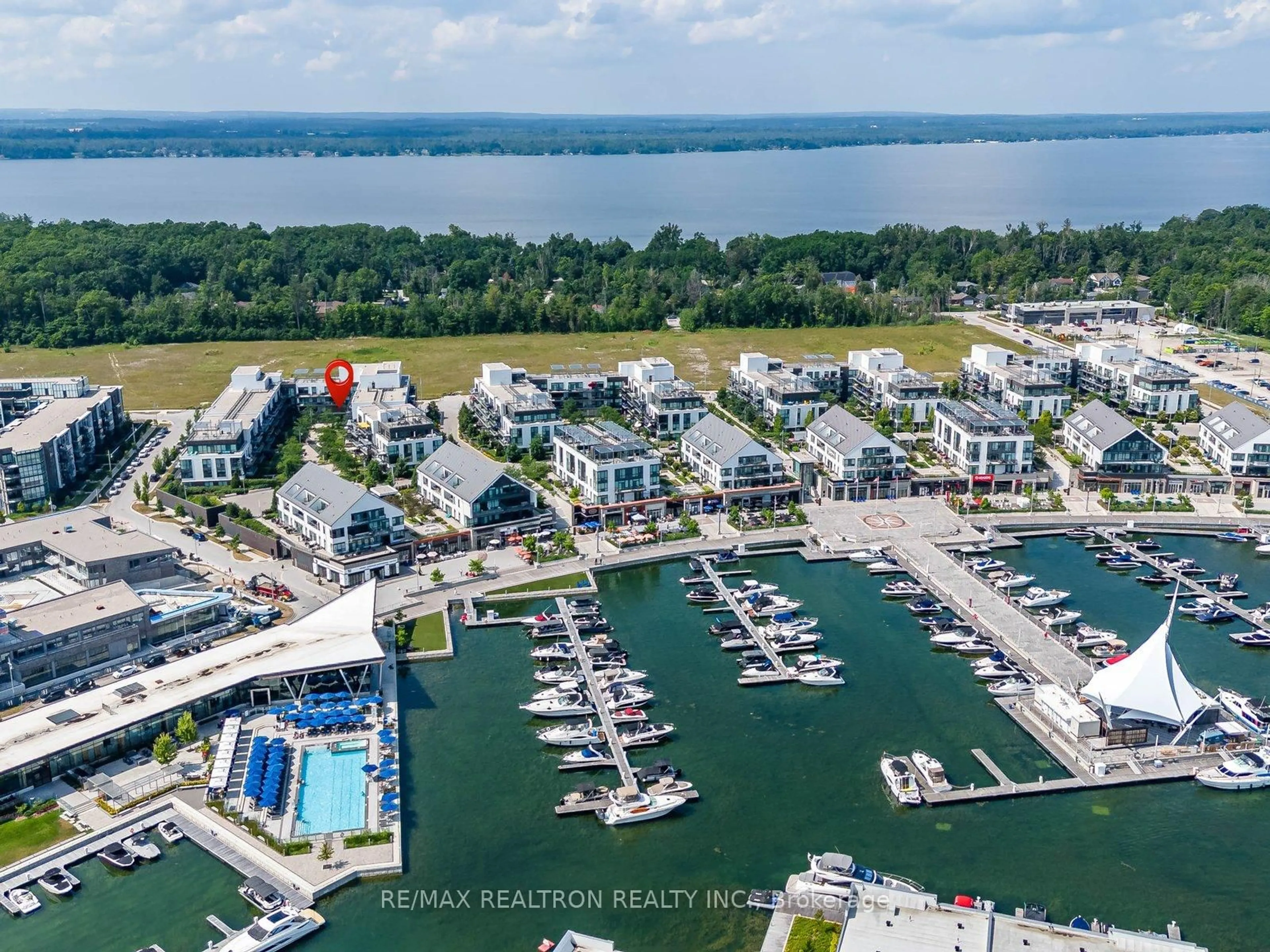 A pic from outside/outdoor area/front of a property/back of a property/a pic from drone, water/lake/river/ocean view for 333 Sea Ray Ave #D201, Innisfil Ontario L9S 0M3