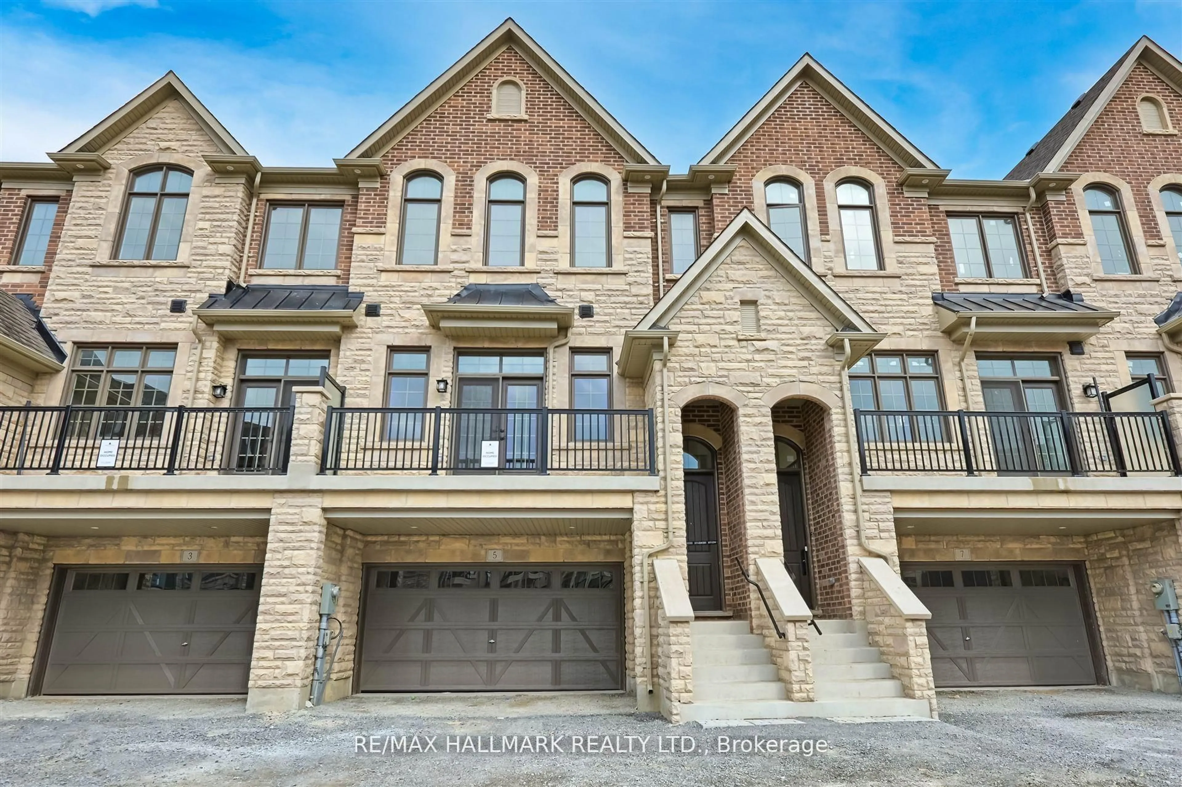 Home with brick exterior material, street for 5 West Village Lane, Markham Ontario L6C 3L5