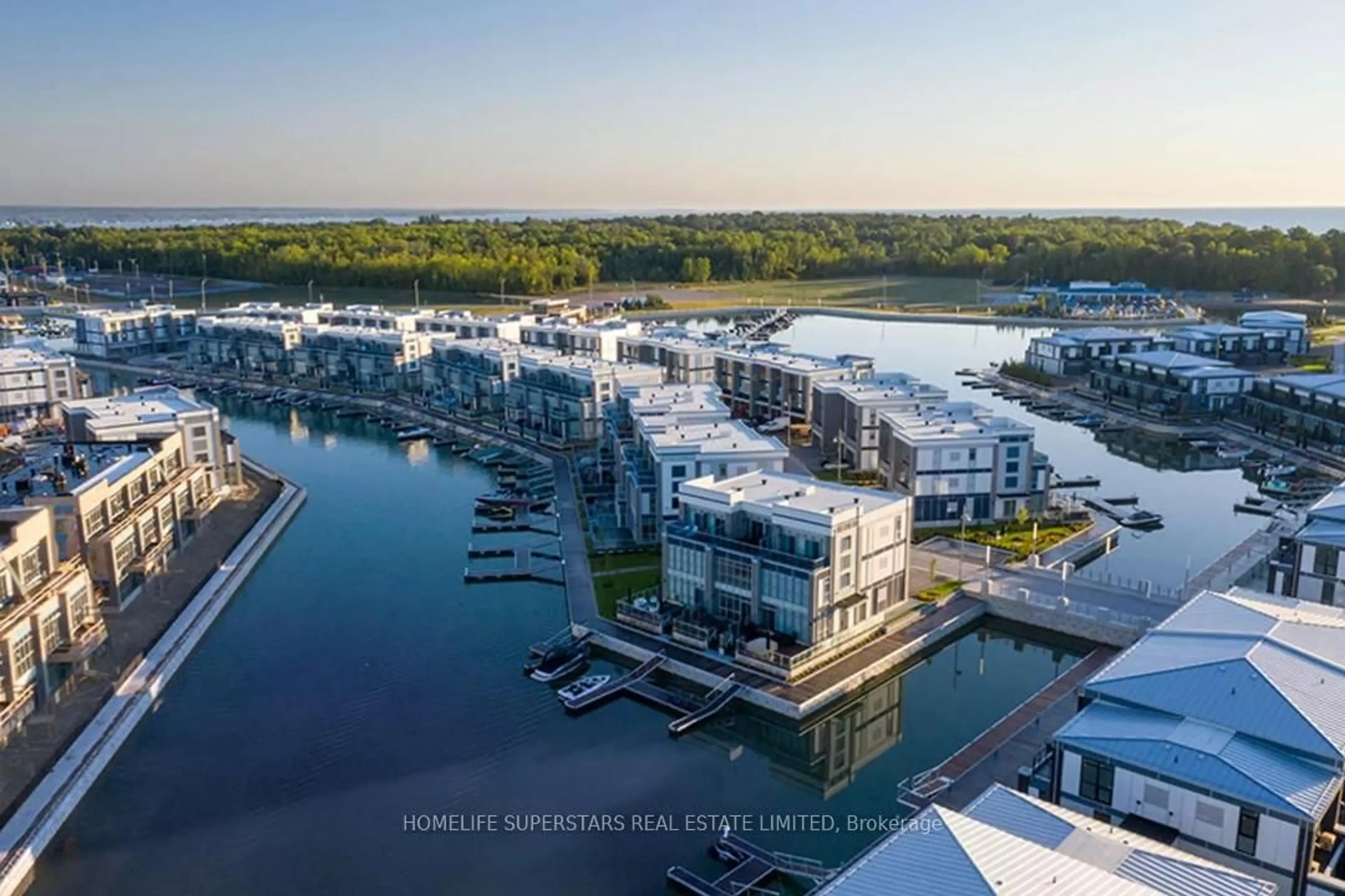 A pic from outside/outdoor area/front of a property/back of a property/a pic from drone, water/lake/river/ocean view for 415 Sea Ray Ave #324, Innisfil Ontario L9S 0R5