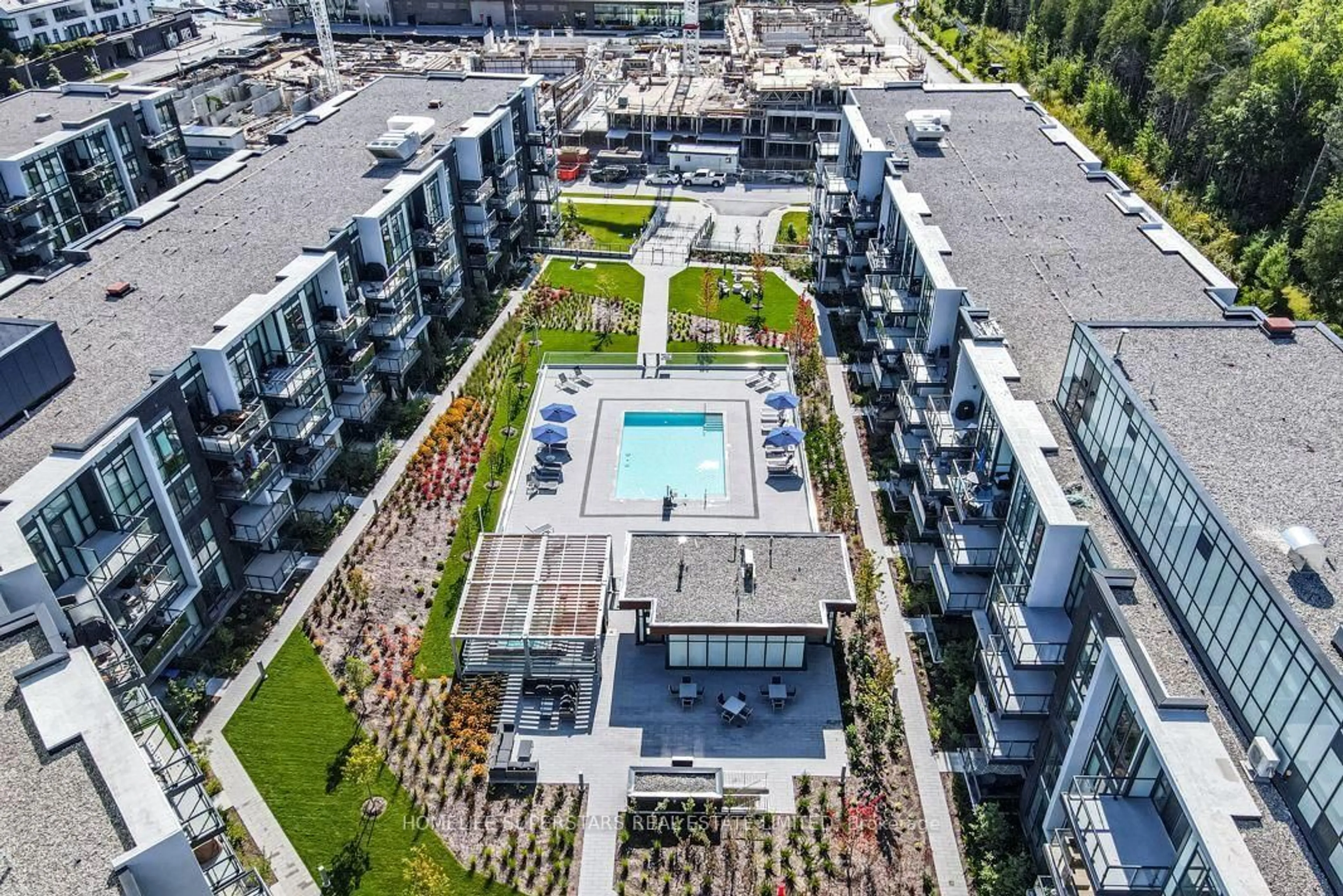 A pic from outside/outdoor area/front of a property/back of a property/a pic from drone, city buildings view from balcony for 415 Sea Ray Ave #324, Innisfil Ontario L9S 0R5