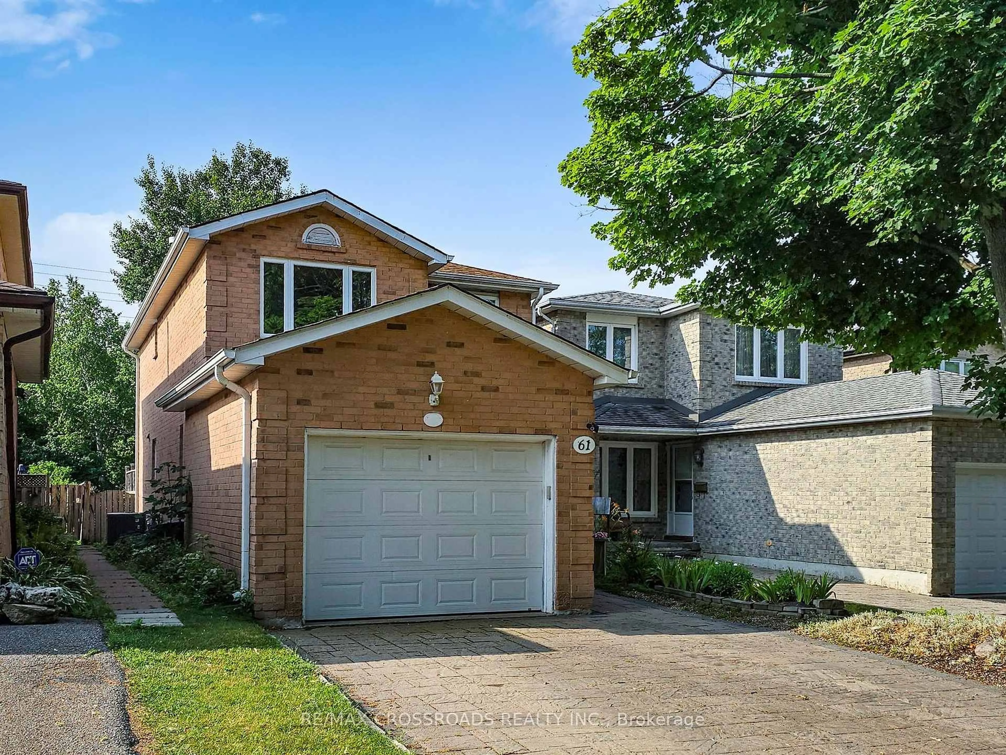 Home with brick exterior material, street for 61 Hamilton Hall Dr, Markham Ontario L3P 3L5