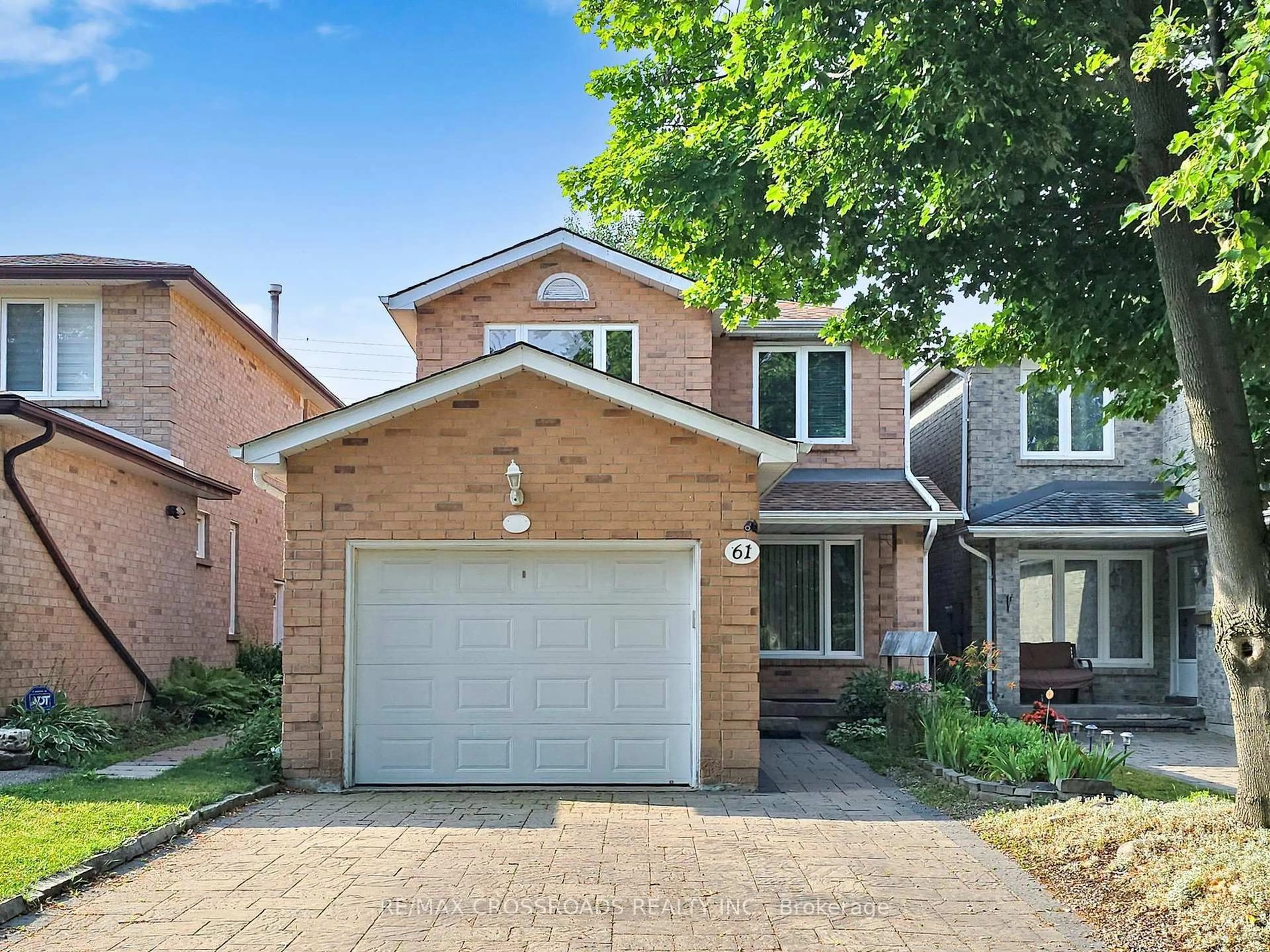 Home with brick exterior material, street for 61 Hamilton Hall Dr, Markham Ontario L3P 3L5