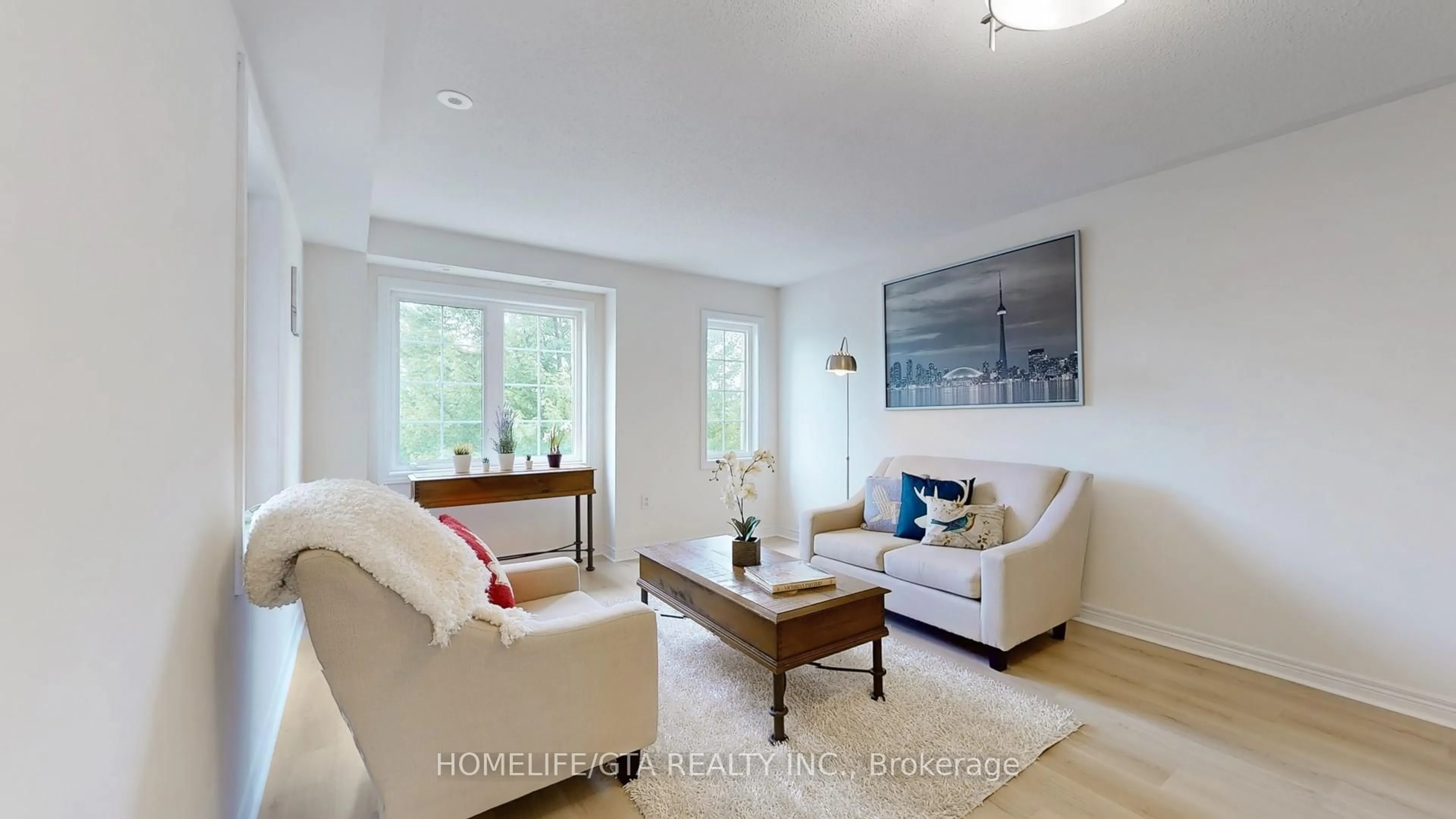 Living room with furniture, wood/laminate floor for 2487 Bur Oak Ave Ave, Markham Ontario L6B 1E9