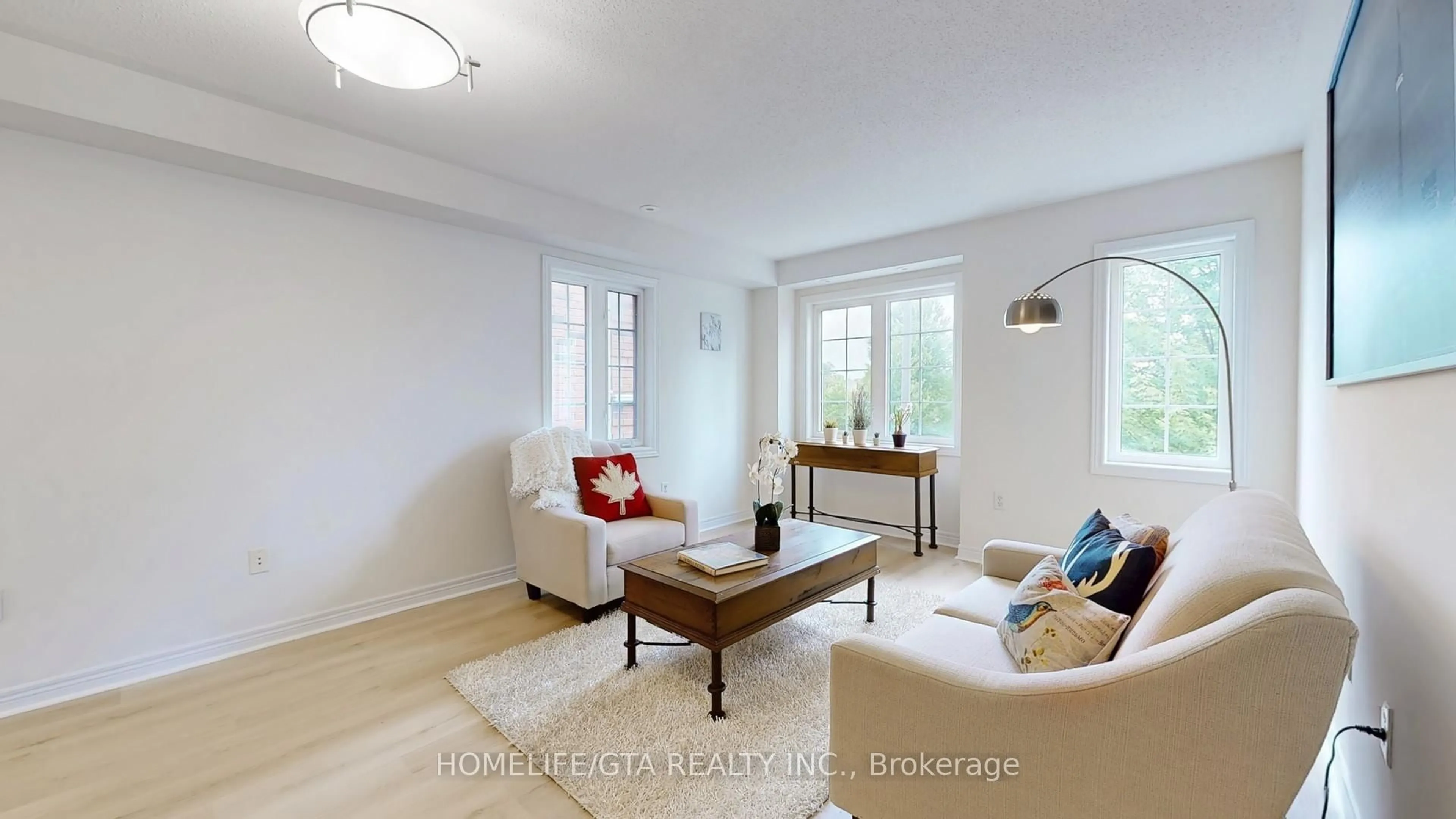 Living room with furniture, wood/laminate floor for 2487 Bur Oak Ave Ave, Markham Ontario L6B 1E9