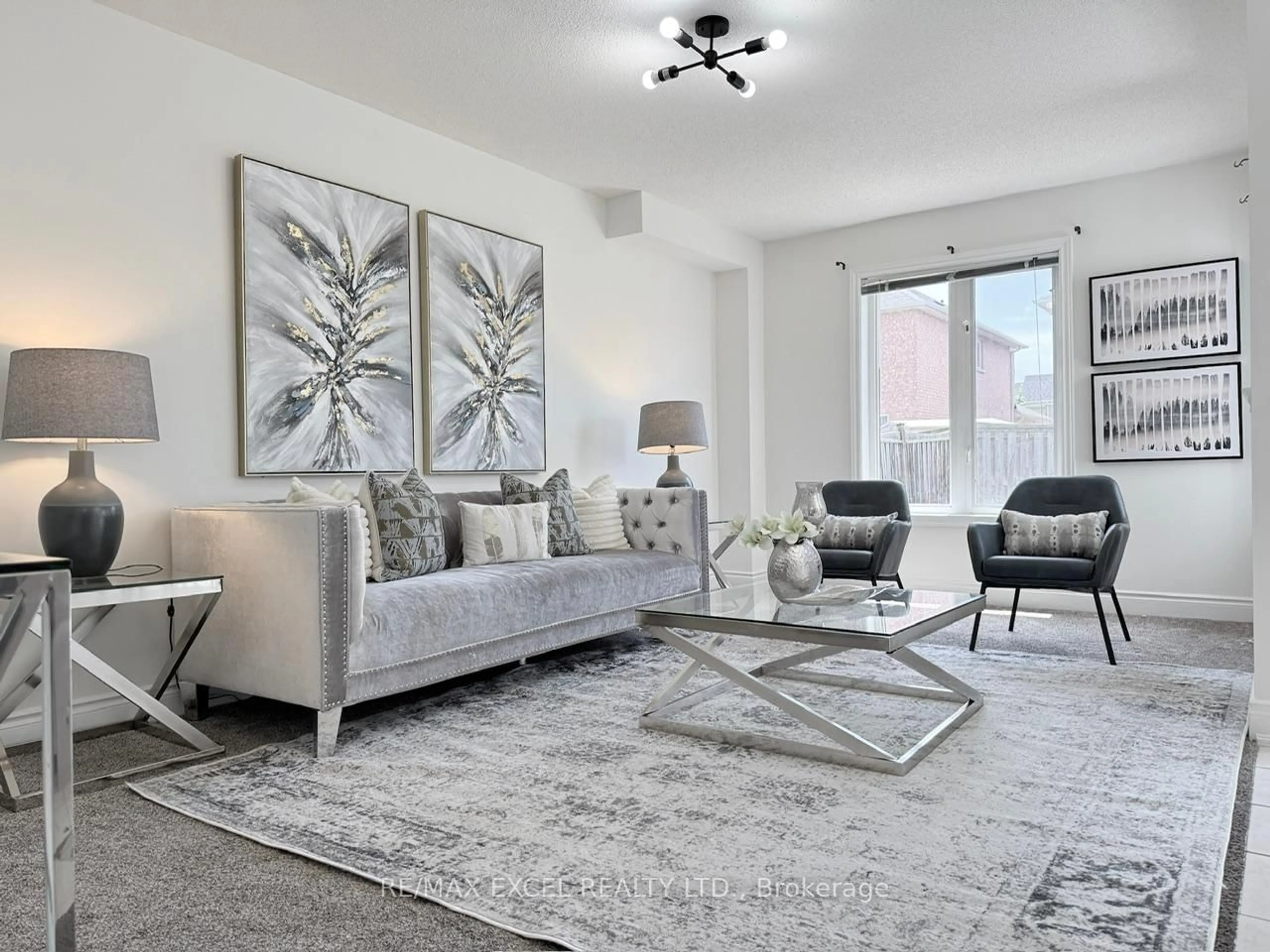 Living room with furniture, carpet floor for 93 Peshawar Ave, Markham Ontario L3R 9V3