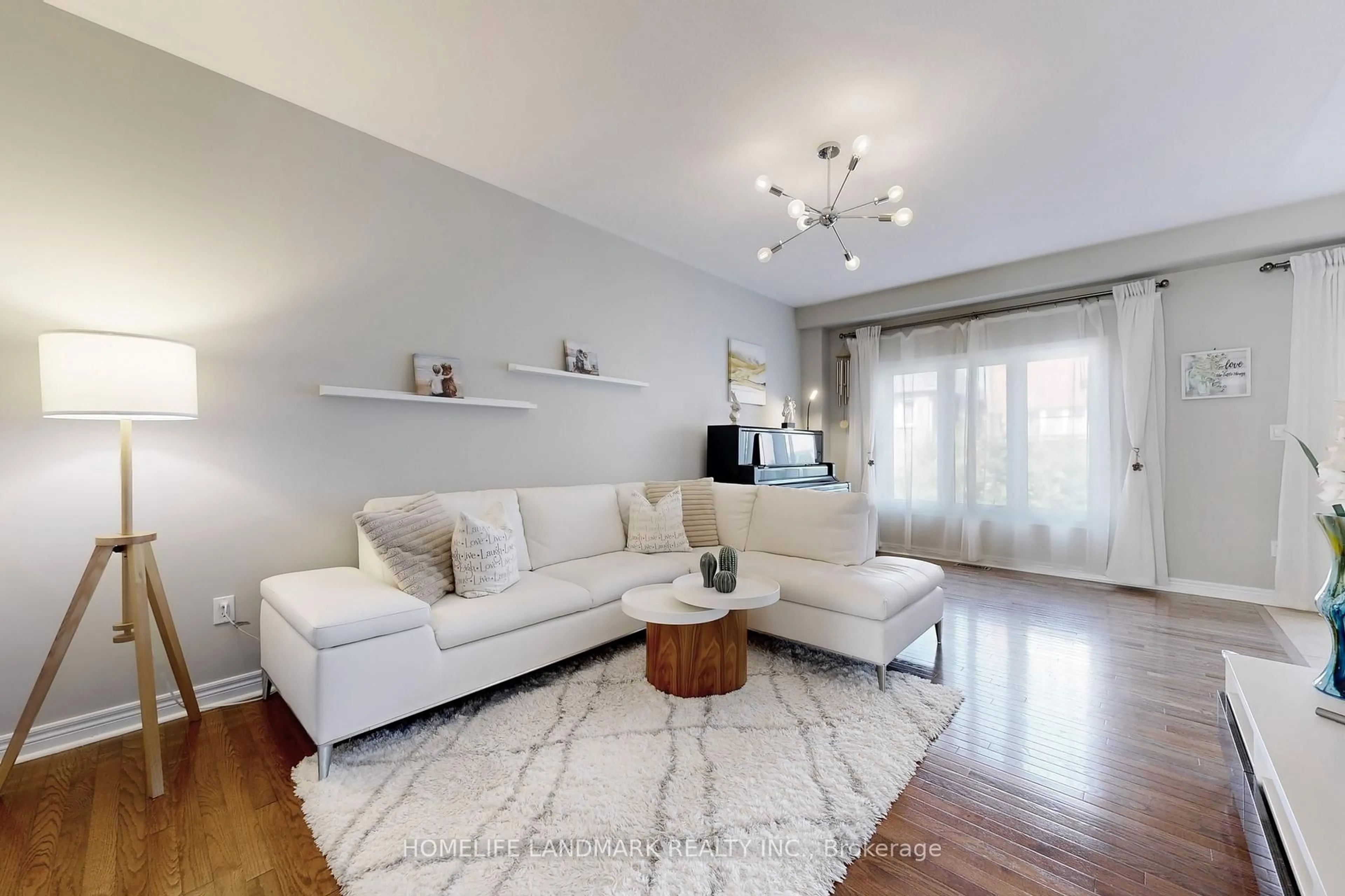 Living room with furniture, wood/laminate floor for 27 Gamla Rd, Vaughan Ontario L6A 0W4