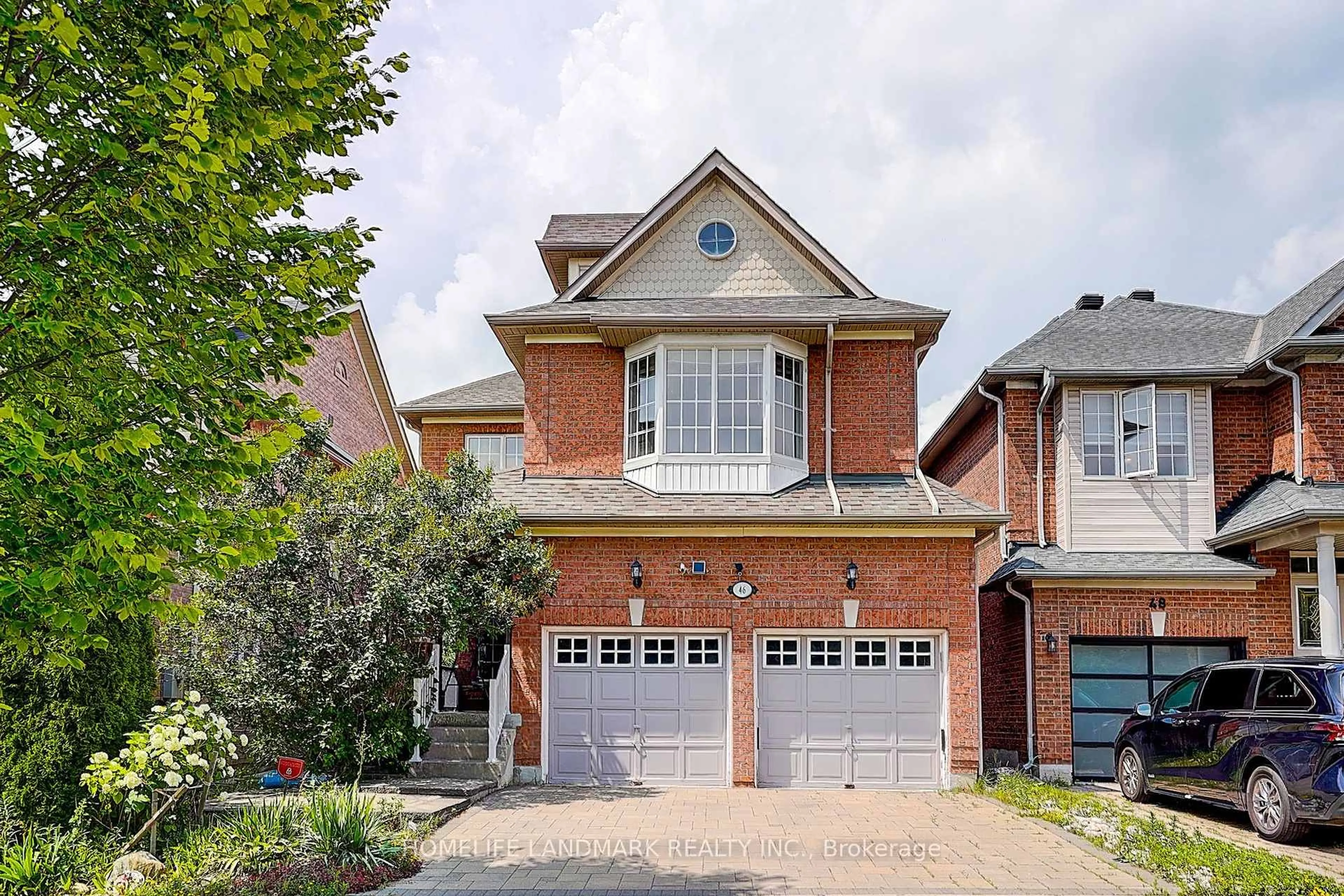 Home with brick exterior material, street for 46 Elmrill Rd, Markham Ontario L6C 2P1