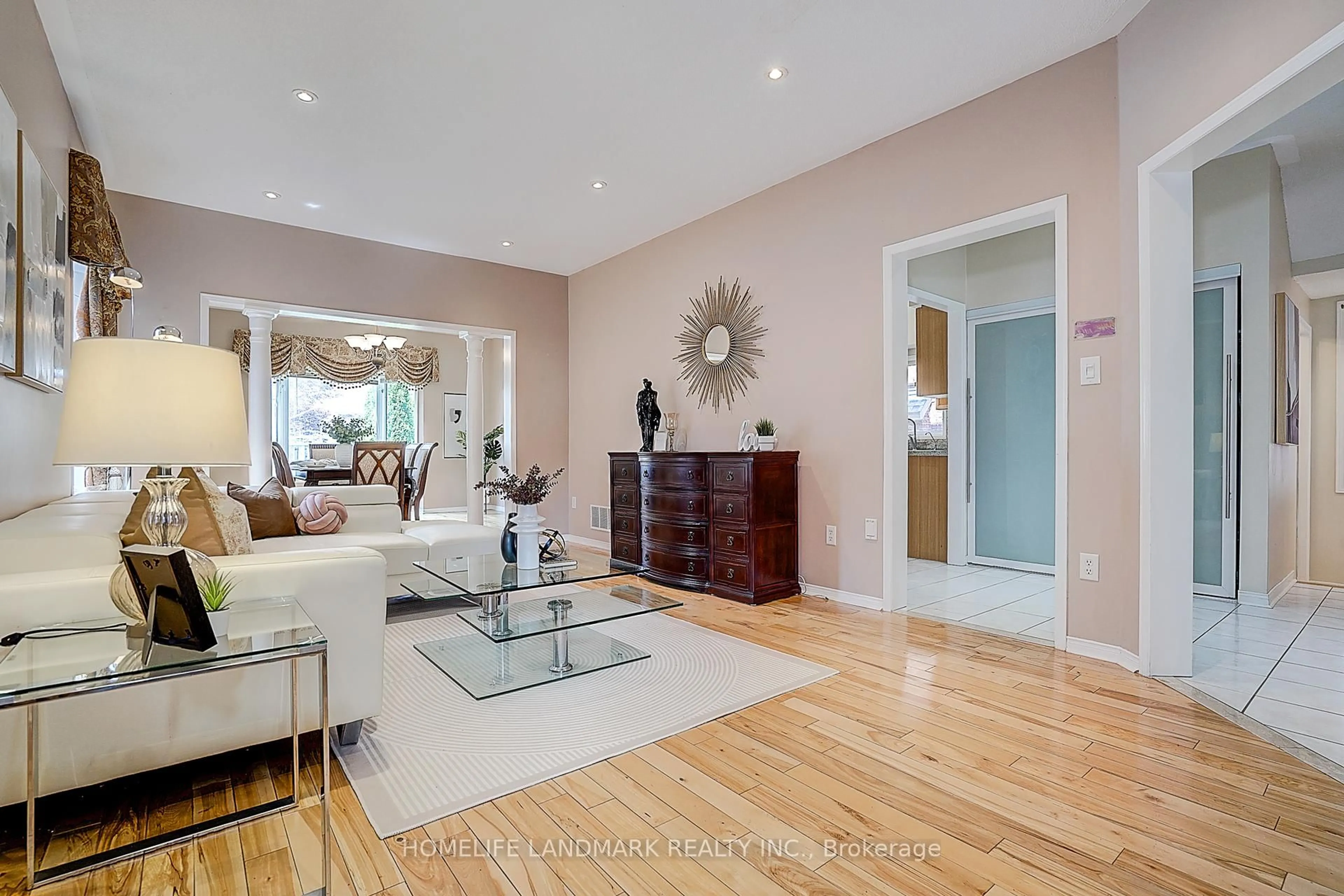 Living room with furniture, wood/laminate floor for 46 Elmrill Rd, Markham Ontario L6C 2P1