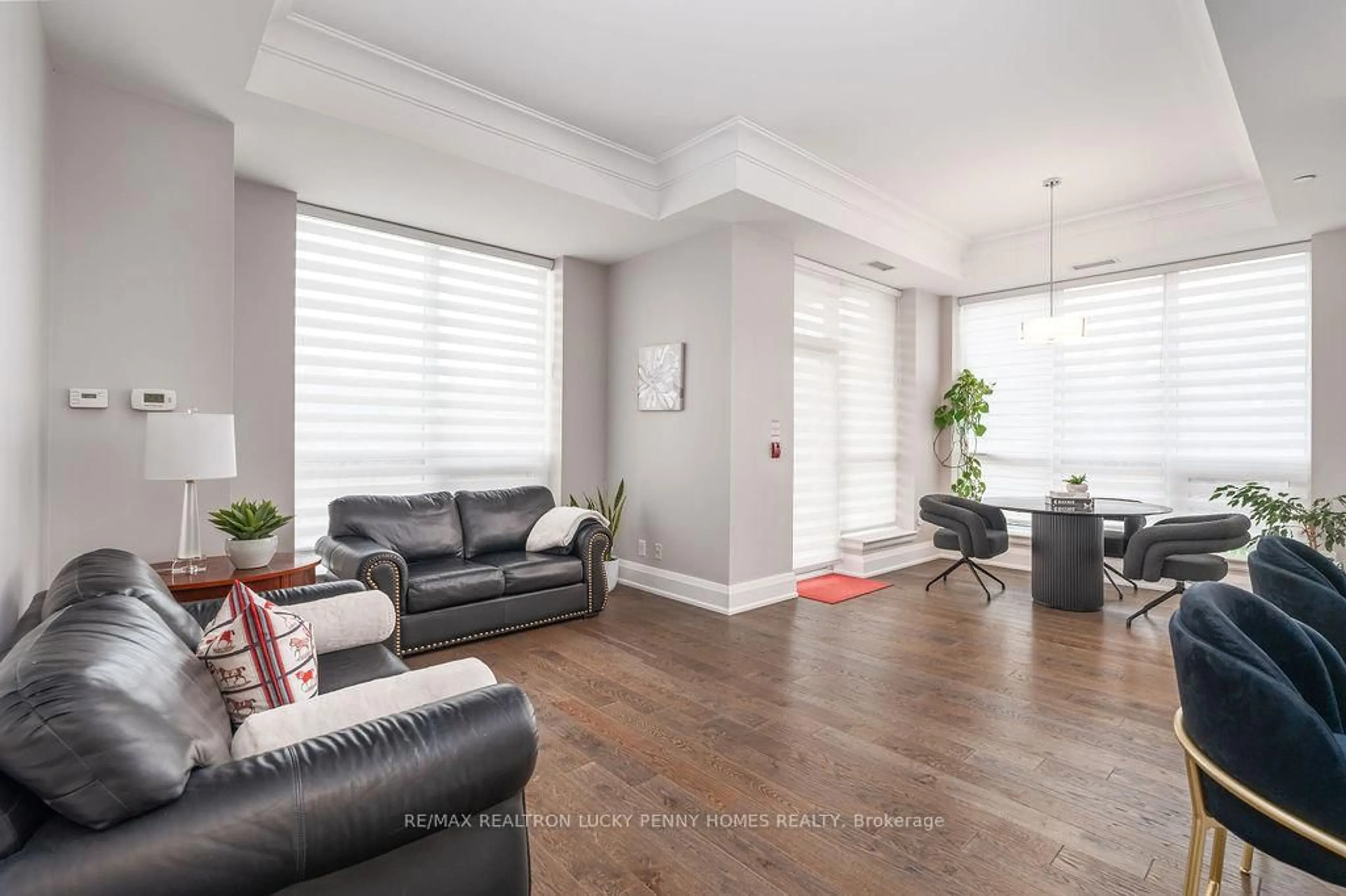 Living room with furniture, unknown for 9 Stollery Pond Cres #212, Markham Ontario L6C 0Y1