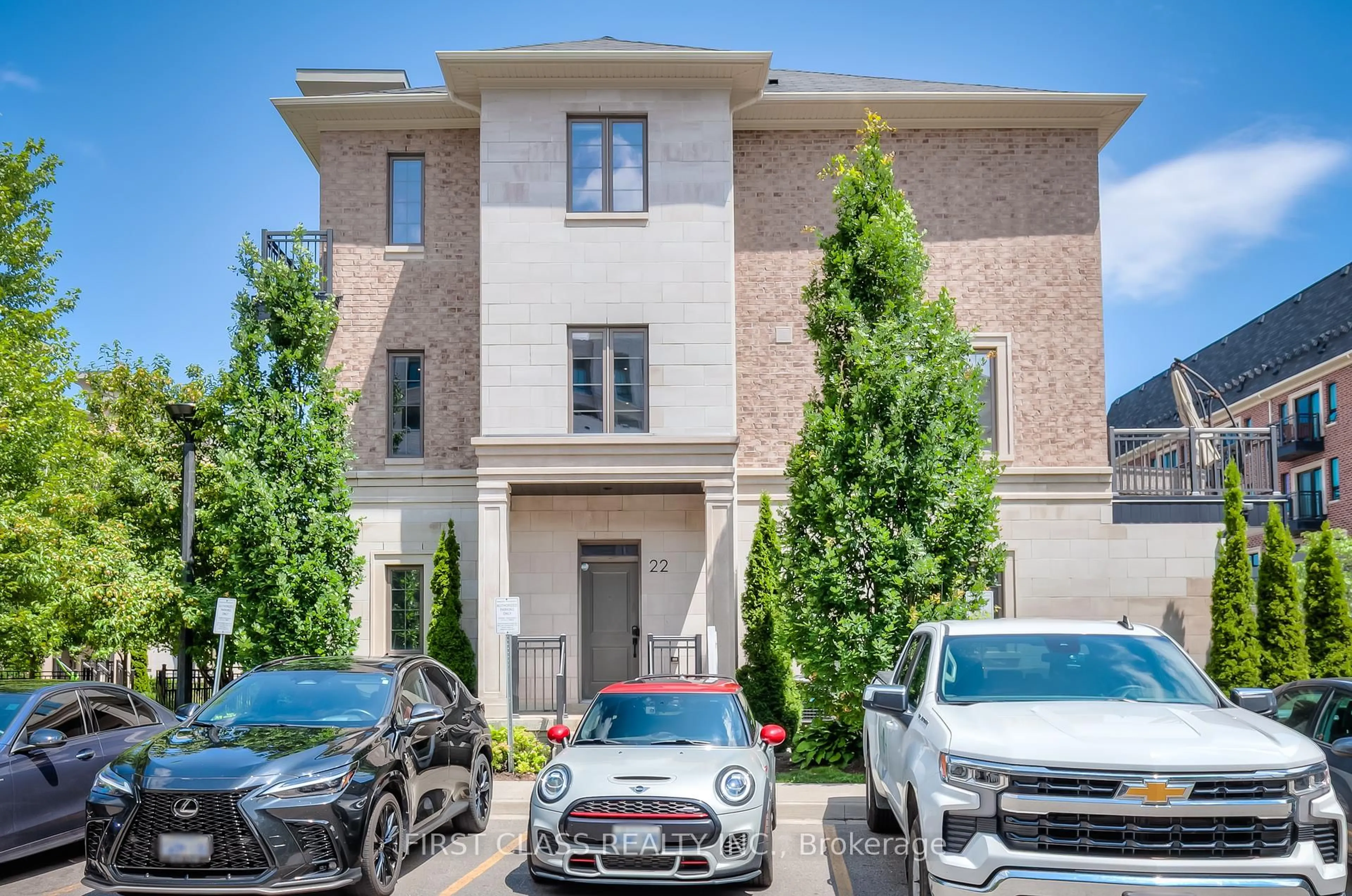 Home with brick exterior material, street for 22 American Elm Way, Markham Ontario L3R 5R8