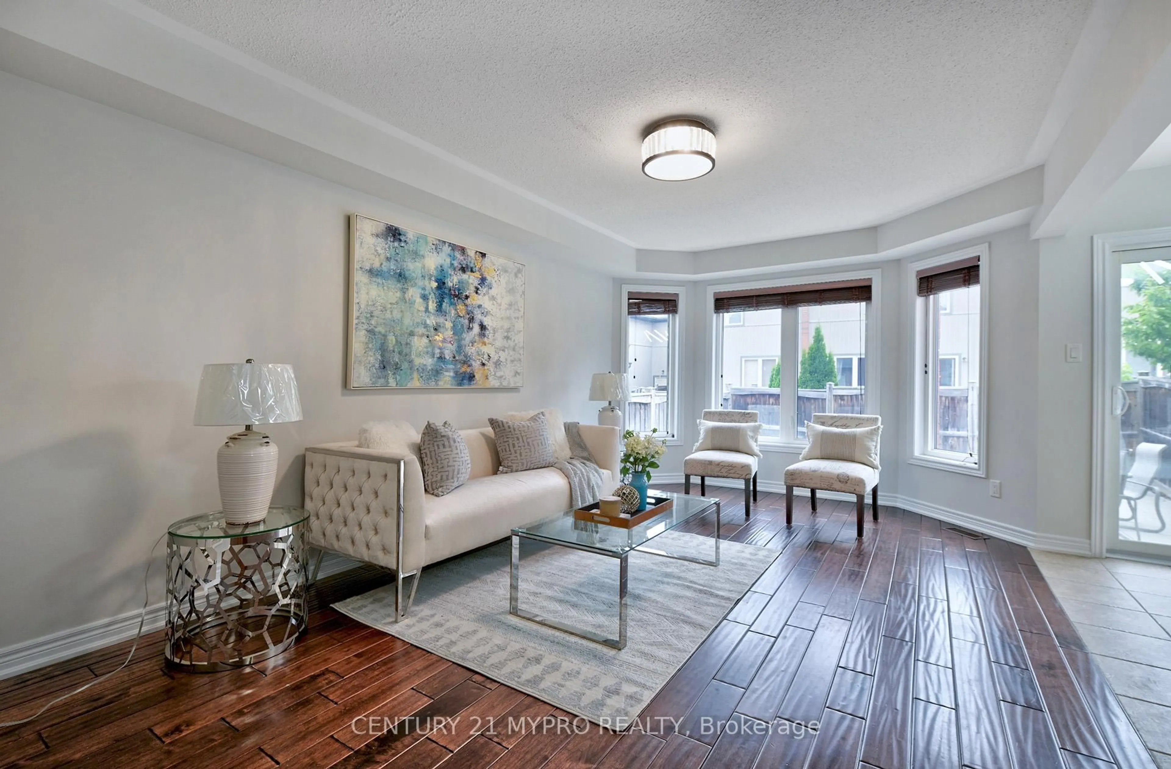 Living room with furniture, wood/laminate floor for 42 Sequin Dr, Richmond Hill Ontario L4E 0J2