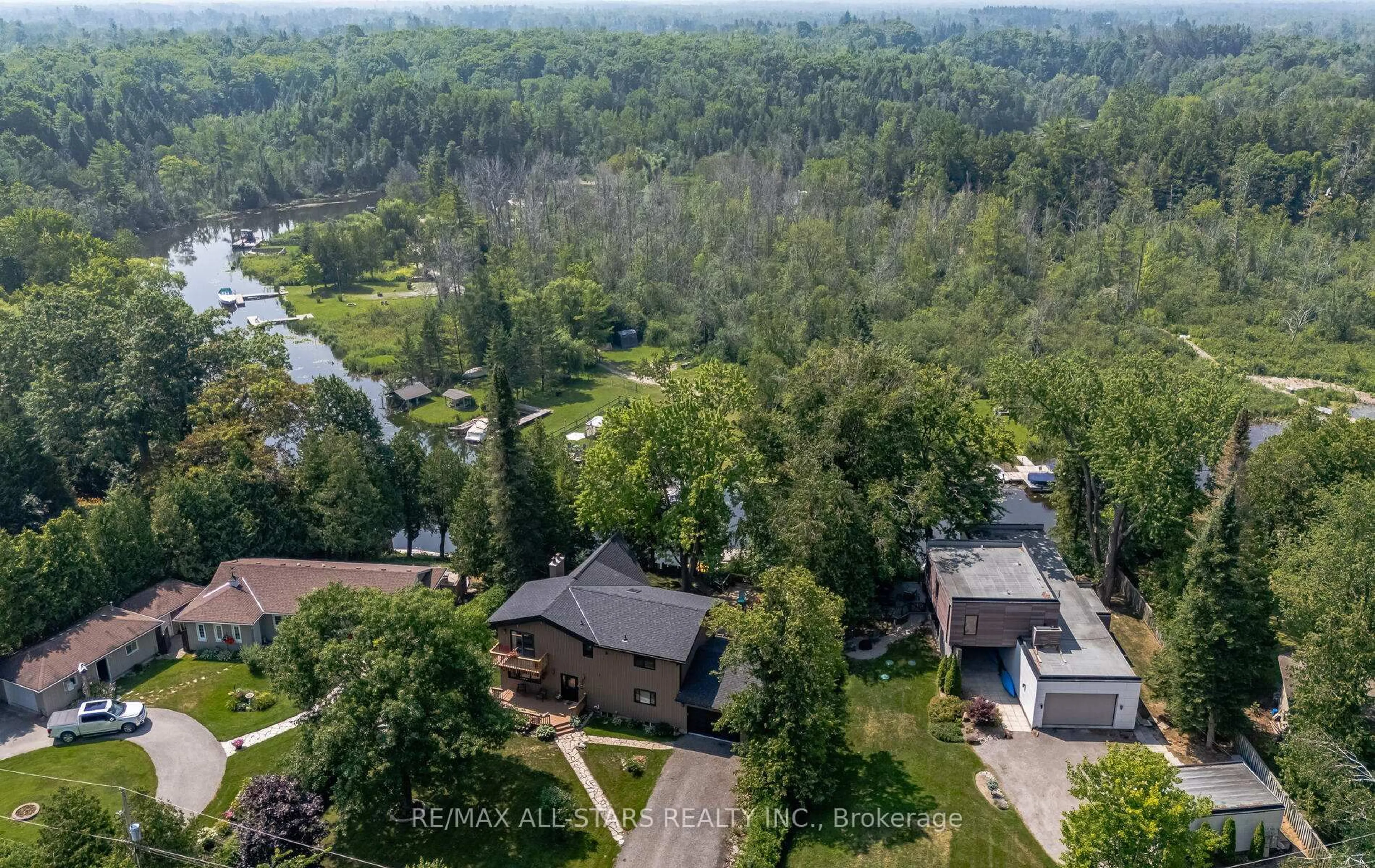 A pic from outside/outdoor area/front of a property/back of a property/a pic from drone, water/lake/river/ocean view for 136 Riverbank Dr, Georgina Ontario L0E 1N0