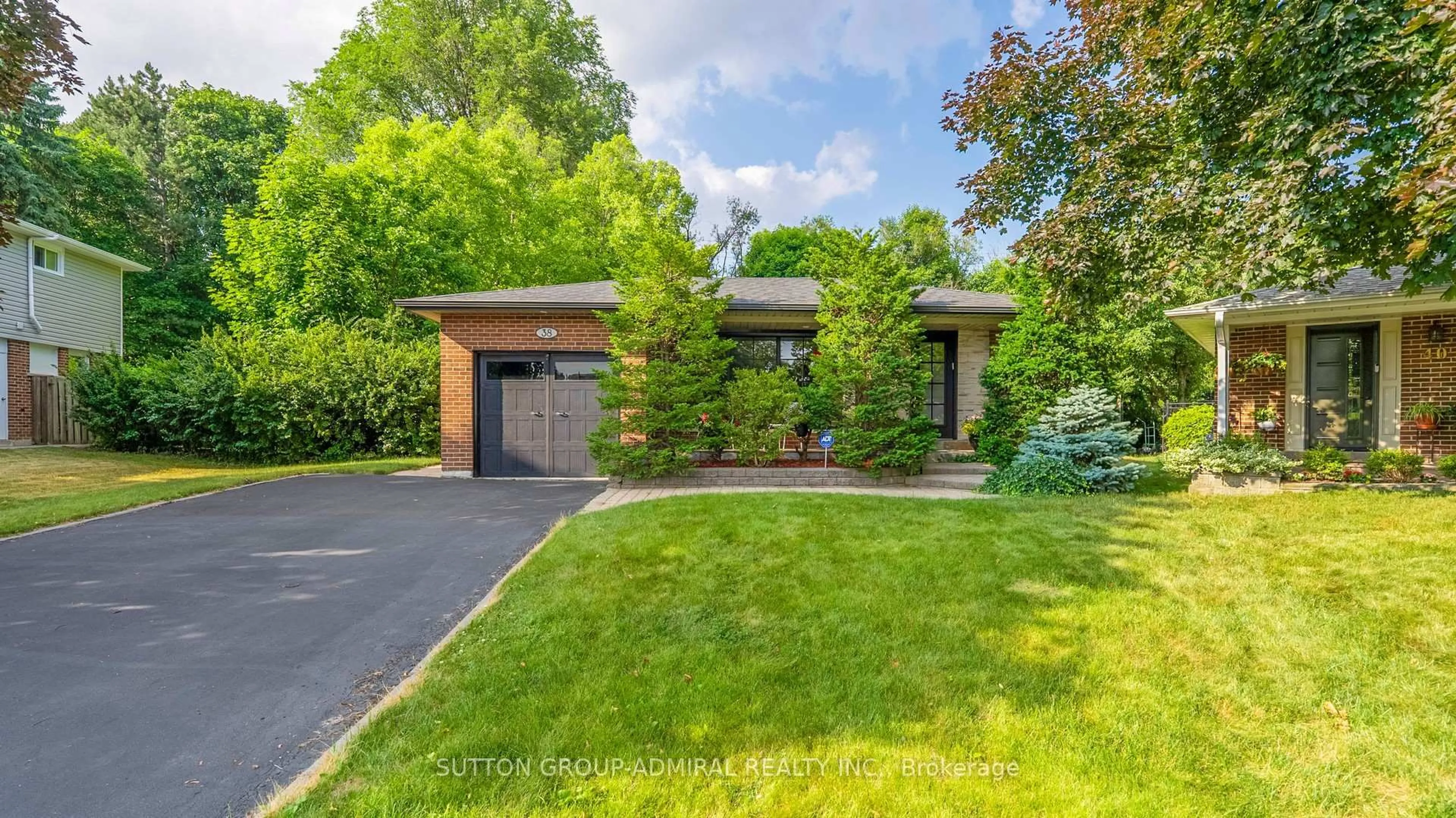 Home with brick exterior material, street for 38 Blue Spruce Lane, Markham Ontario L3T 3W9