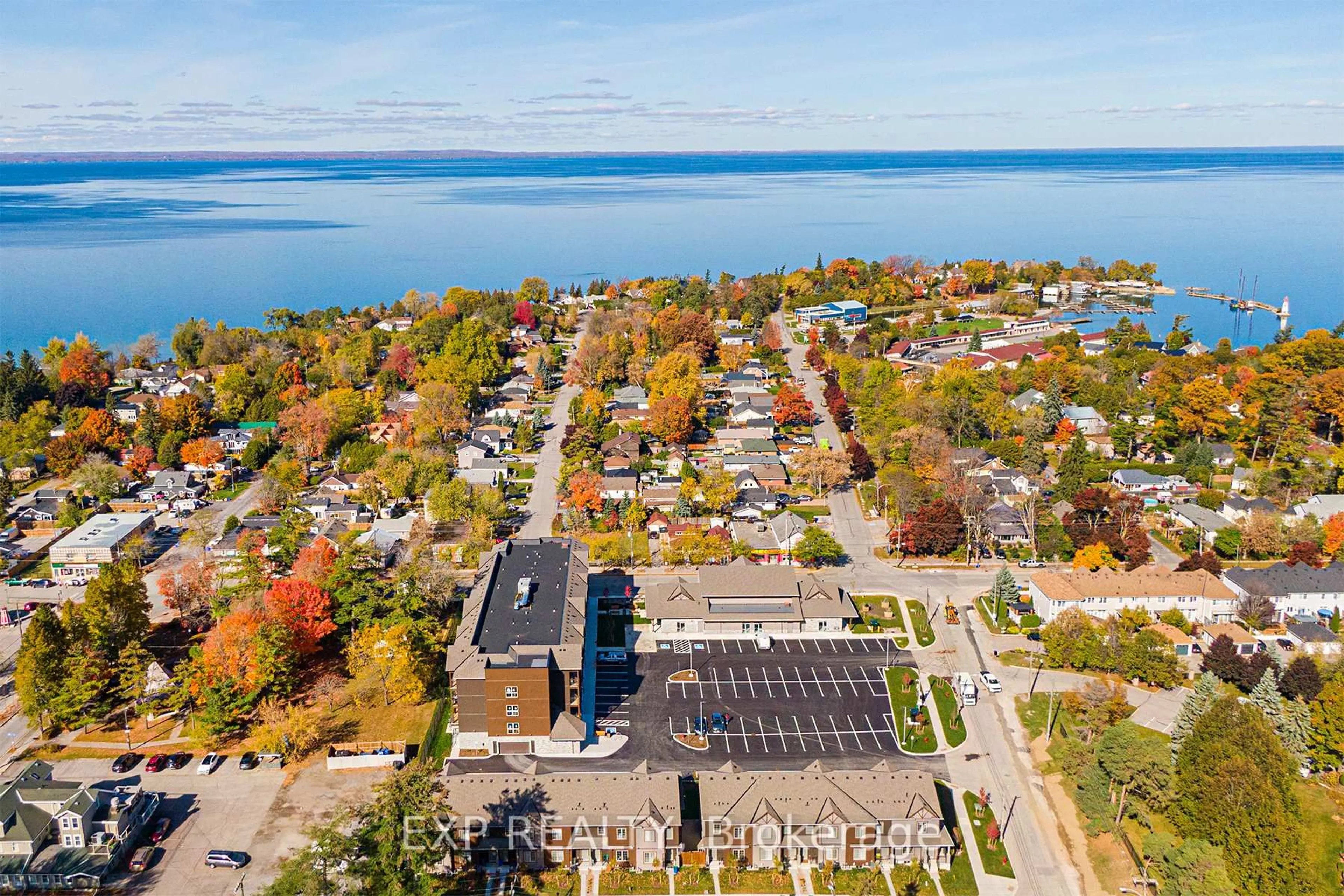 A pic from outside/outdoor area/front of a property/back of a property/a pic from drone, water/lake/river/ocean view for 110 Grew Blvd #407, Georgina Ontario L0E 1L0