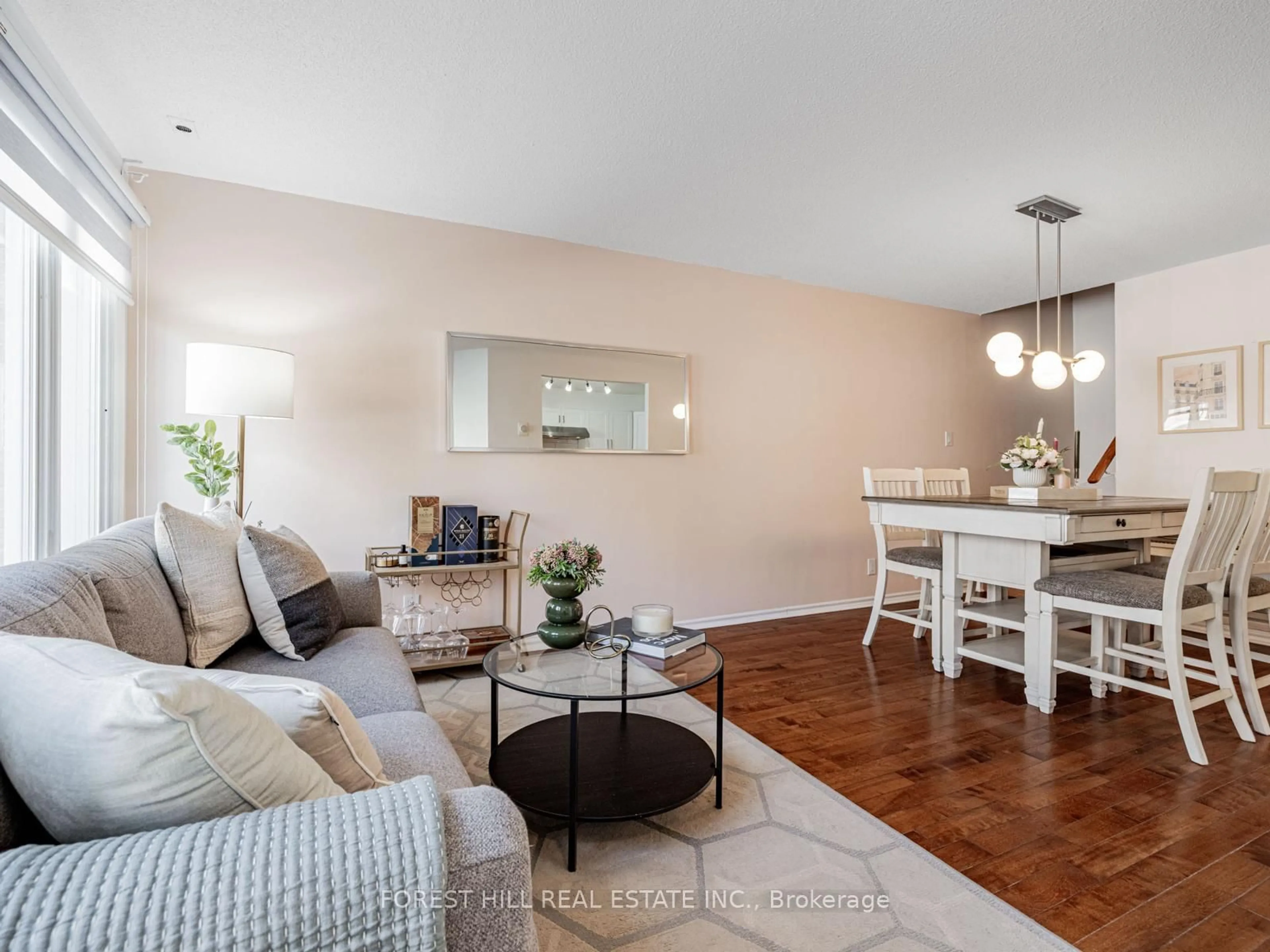 Living room with furniture, wood/laminate floor for 151 Townsgate Dr #95, Vaughan Ontario L4J 8J7