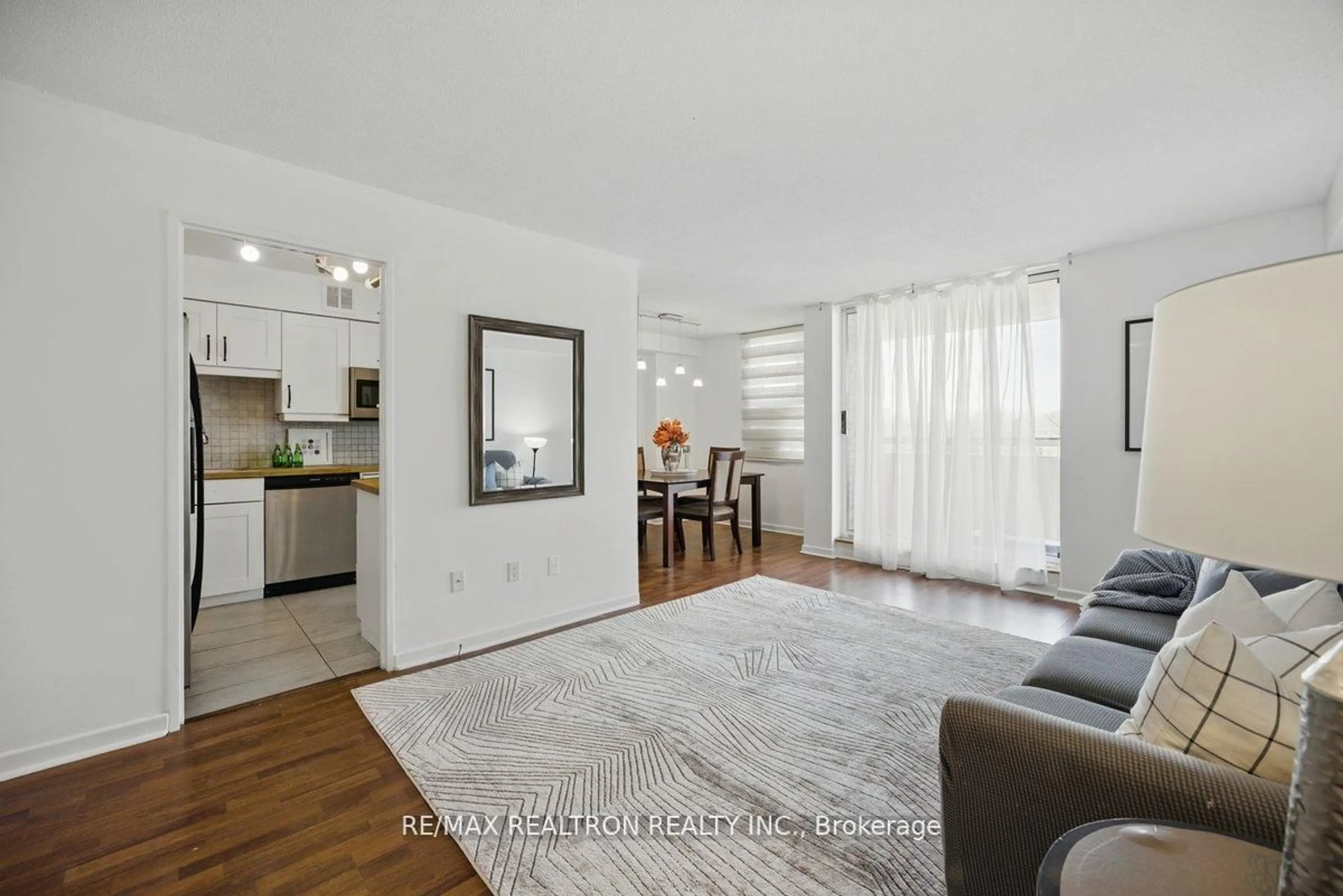 Living room with furniture, wood/laminate floor for 80 Inverlochy Blvd #501, Markham Ontario L3T 4P3