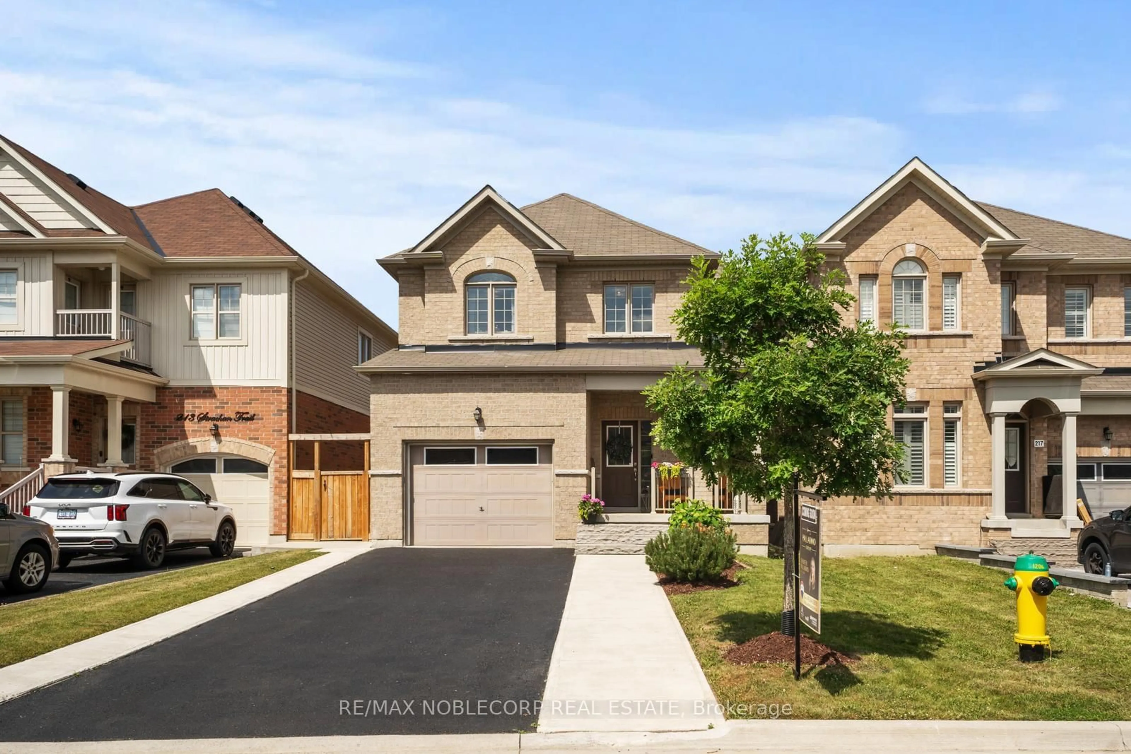 Home with brick exterior material, street for 215 Strachan Tr, New Tecumseth Ontario L0G 1A0