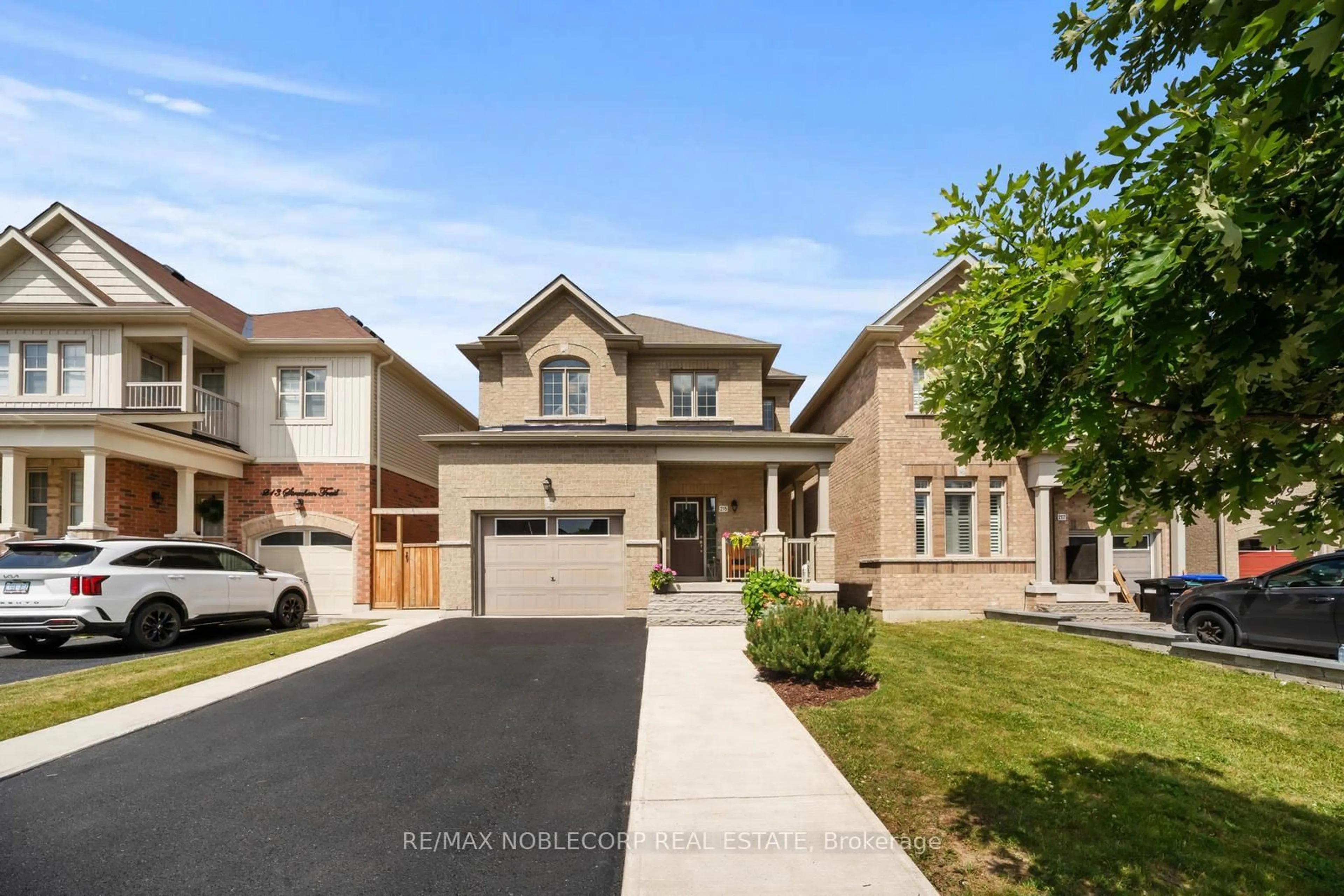 Home with brick exterior material, street for 215 Strachan Tr, New Tecumseth Ontario L0G 1A0