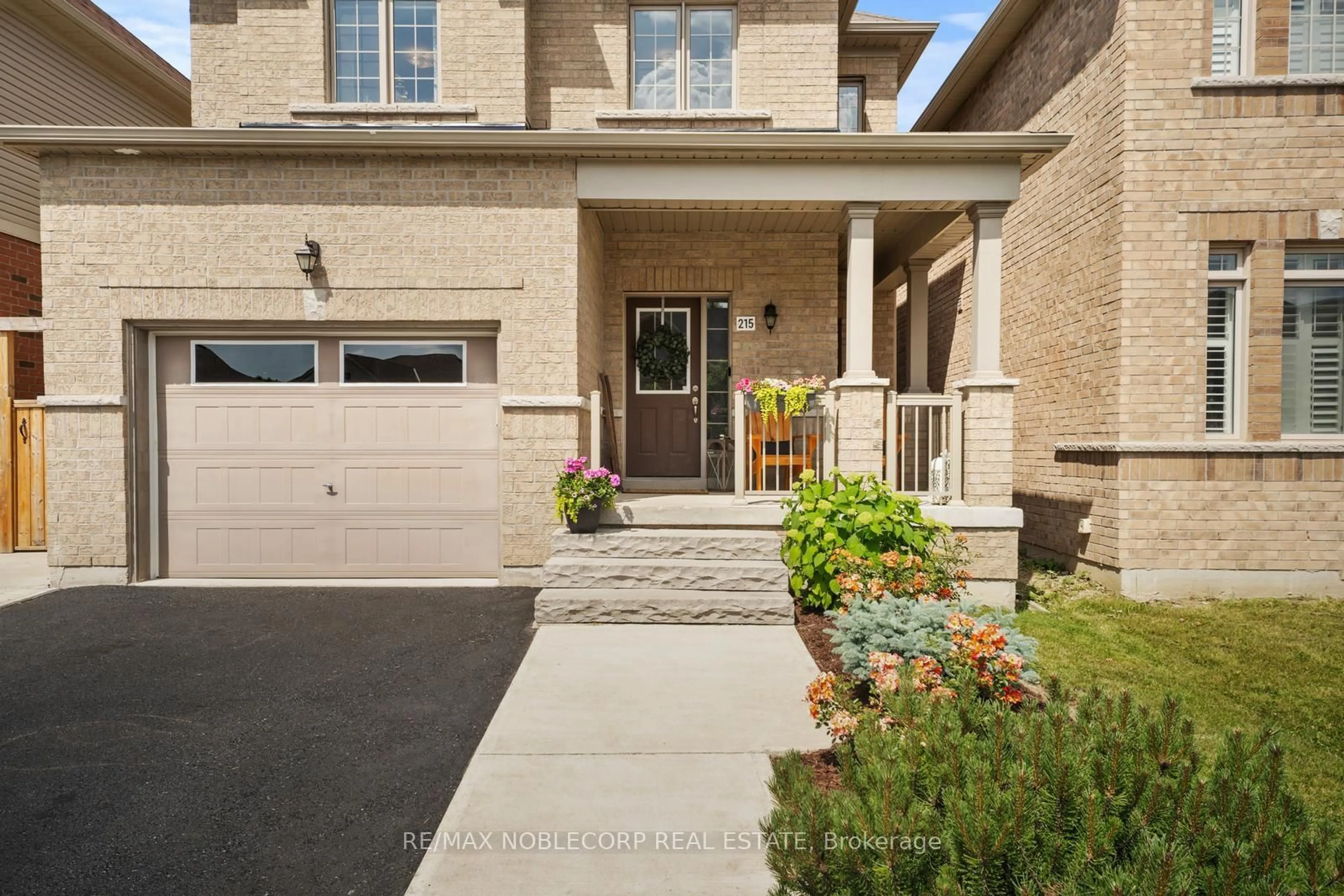 Home with brick exterior material, street for 215 Strachan Tr, New Tecumseth Ontario L0G 1A0