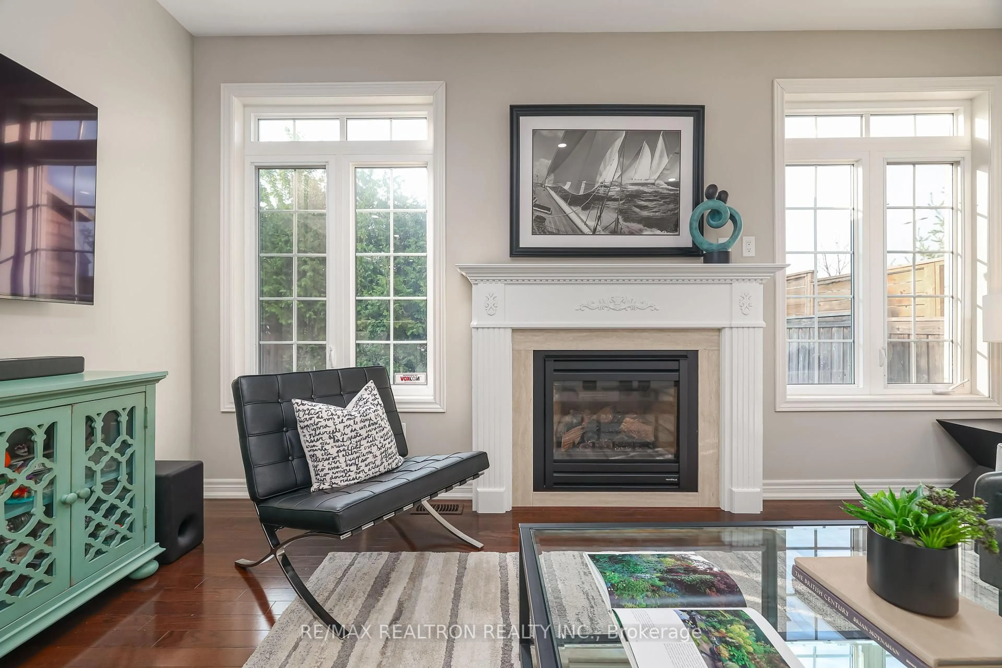Living room with furniture, wood/laminate floor for 42 Southvale Dr, Vaughan Ontario L6A 0Y6