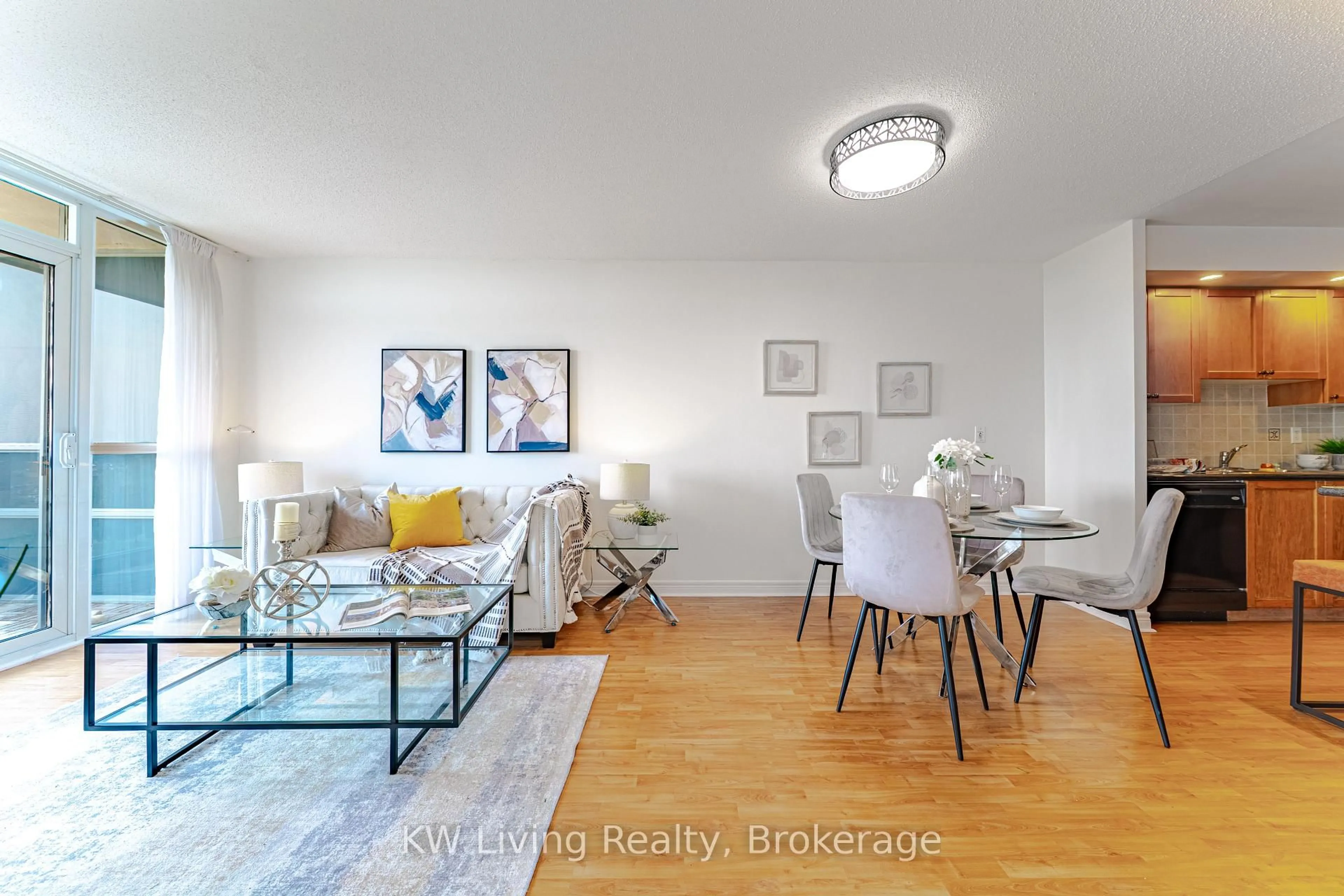 Living room with furniture, wood/laminate floor for 33 Cox Blvd #727, Markham Ontario L3R 8A6