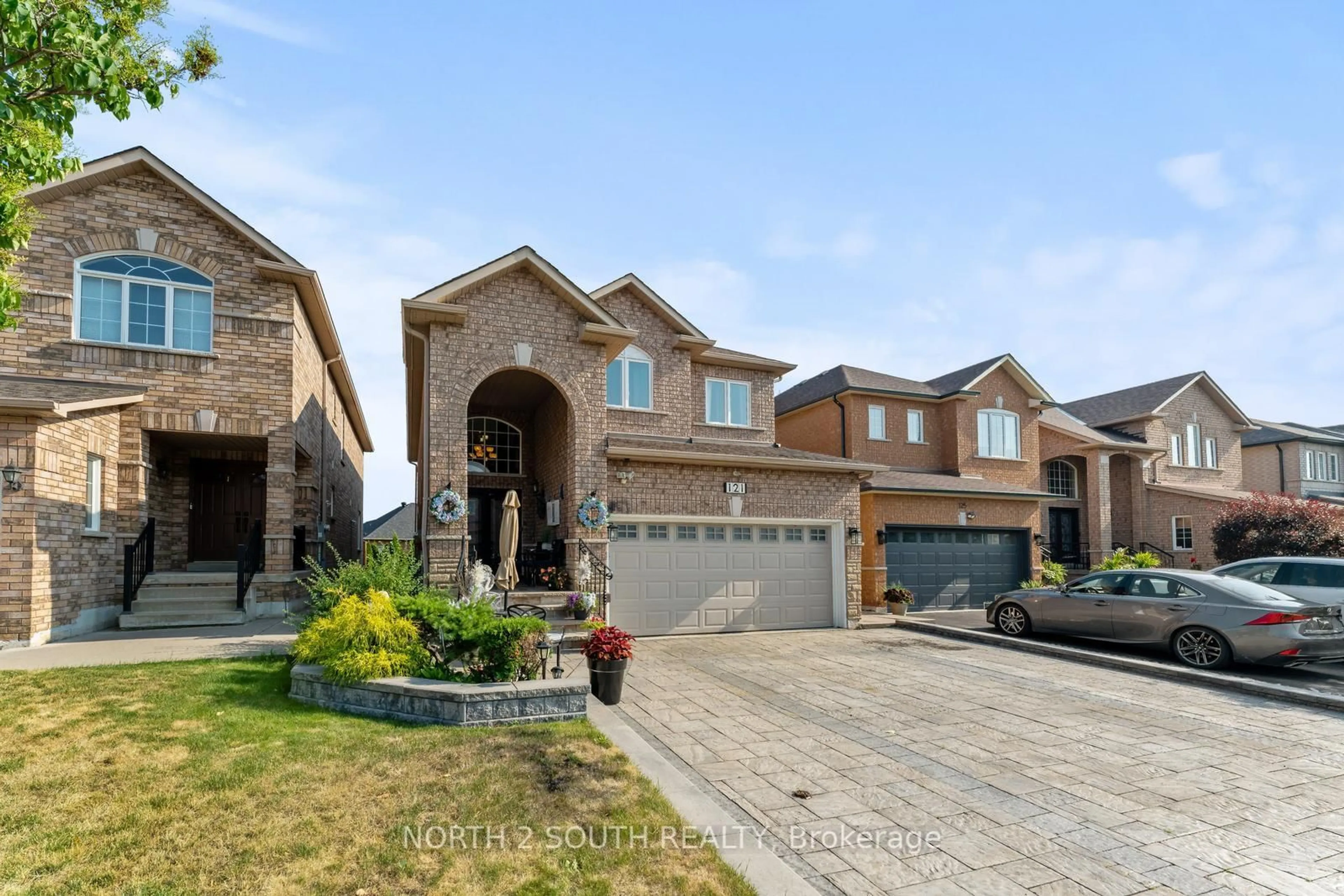 Home with brick exterior material, street for 121 Royal Pine Ave, Vaughan Ontario L4H 1S8