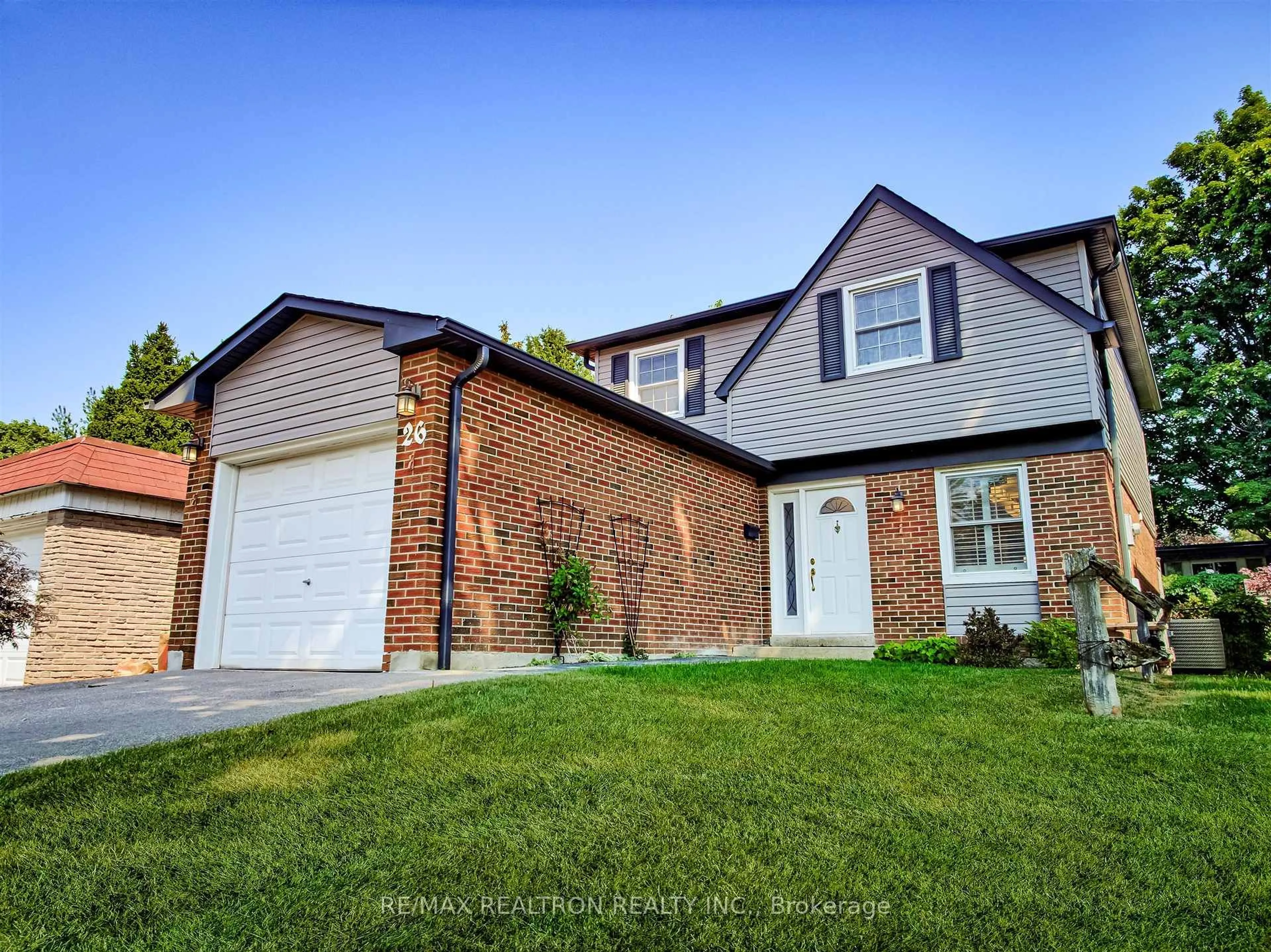 Home with brick exterior material, street for 26 Ravengloss Dr, Markham Ontario L3T 4C9