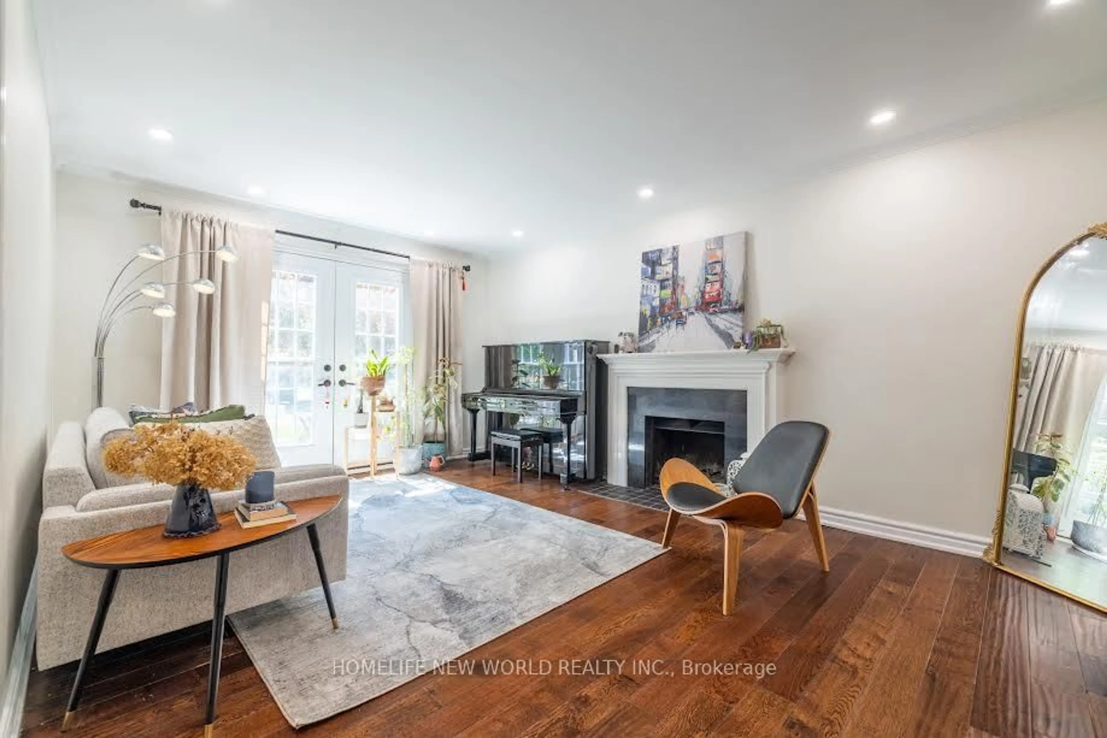 Living room with furniture, wood/laminate floor for 36 Whitfield Crt, Aurora Ontario L4G 5L7