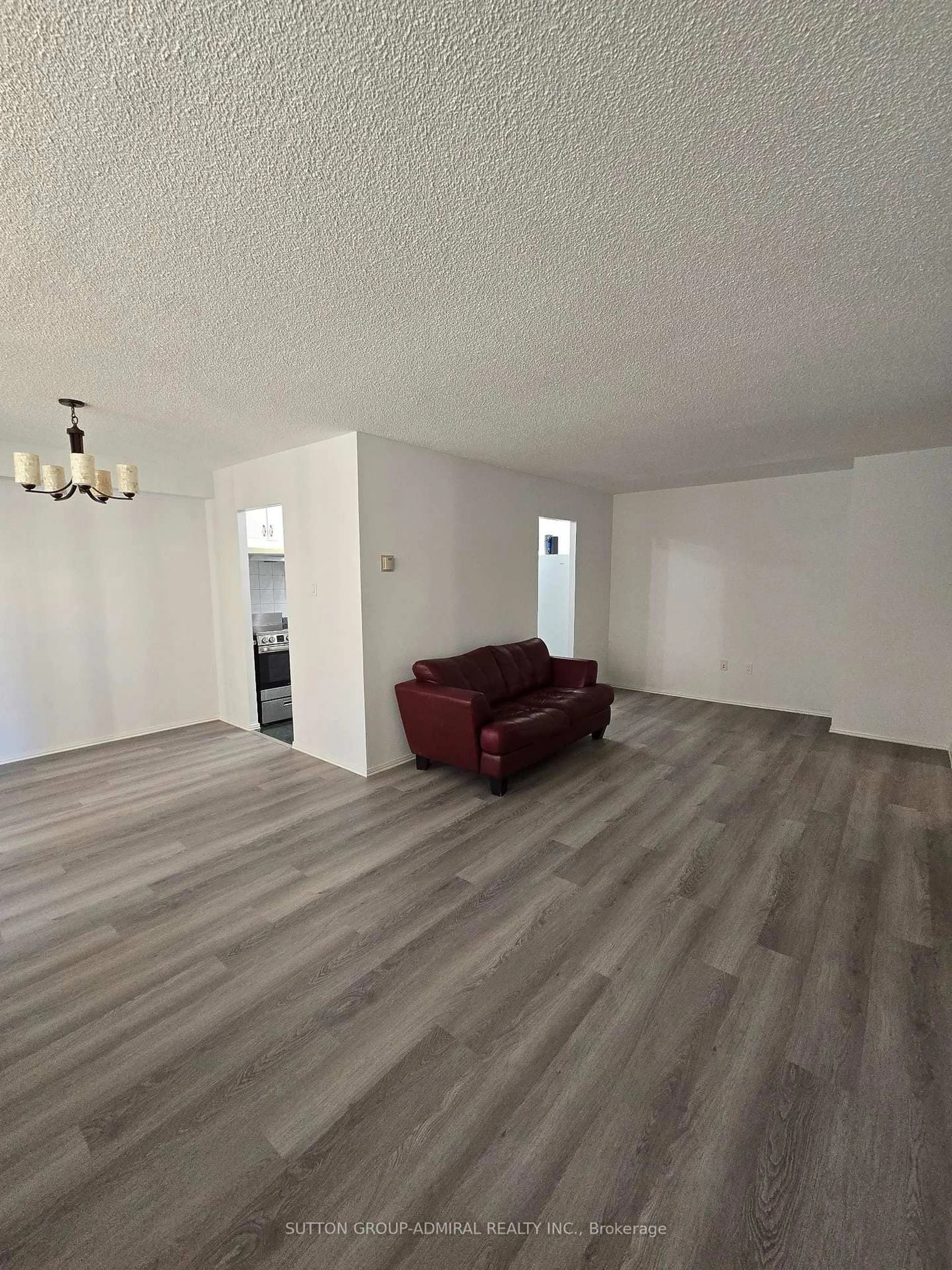 Living room with furniture, wood/laminate floor for 180 Dudley Ave #205, Markham Ontario L3T 4X2
