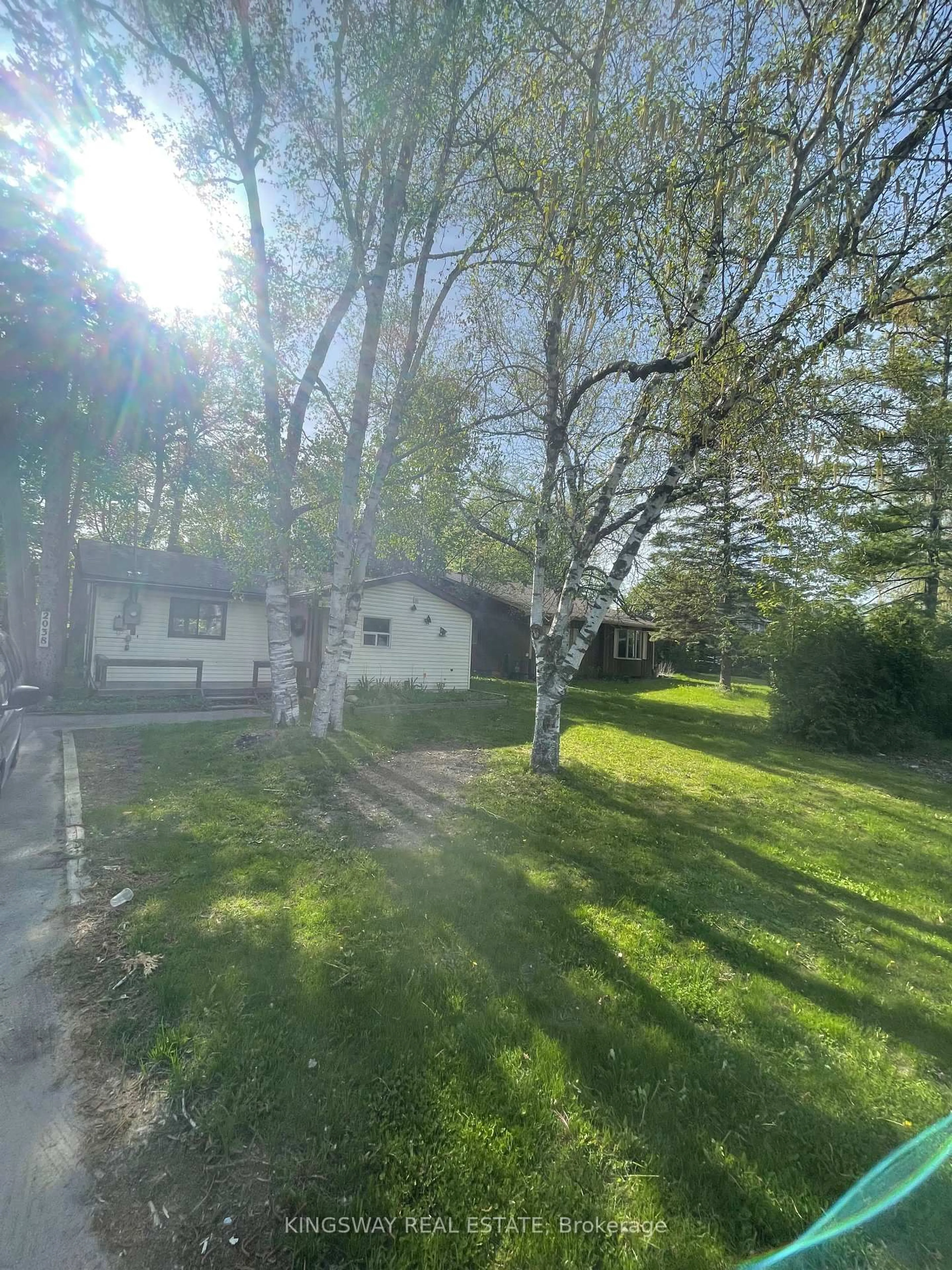 A pic from outside/outdoor area/front of a property/back of a property/a pic from drone, street for 2038 St Johns Rd, Innisfil Ontario L9S 1V4