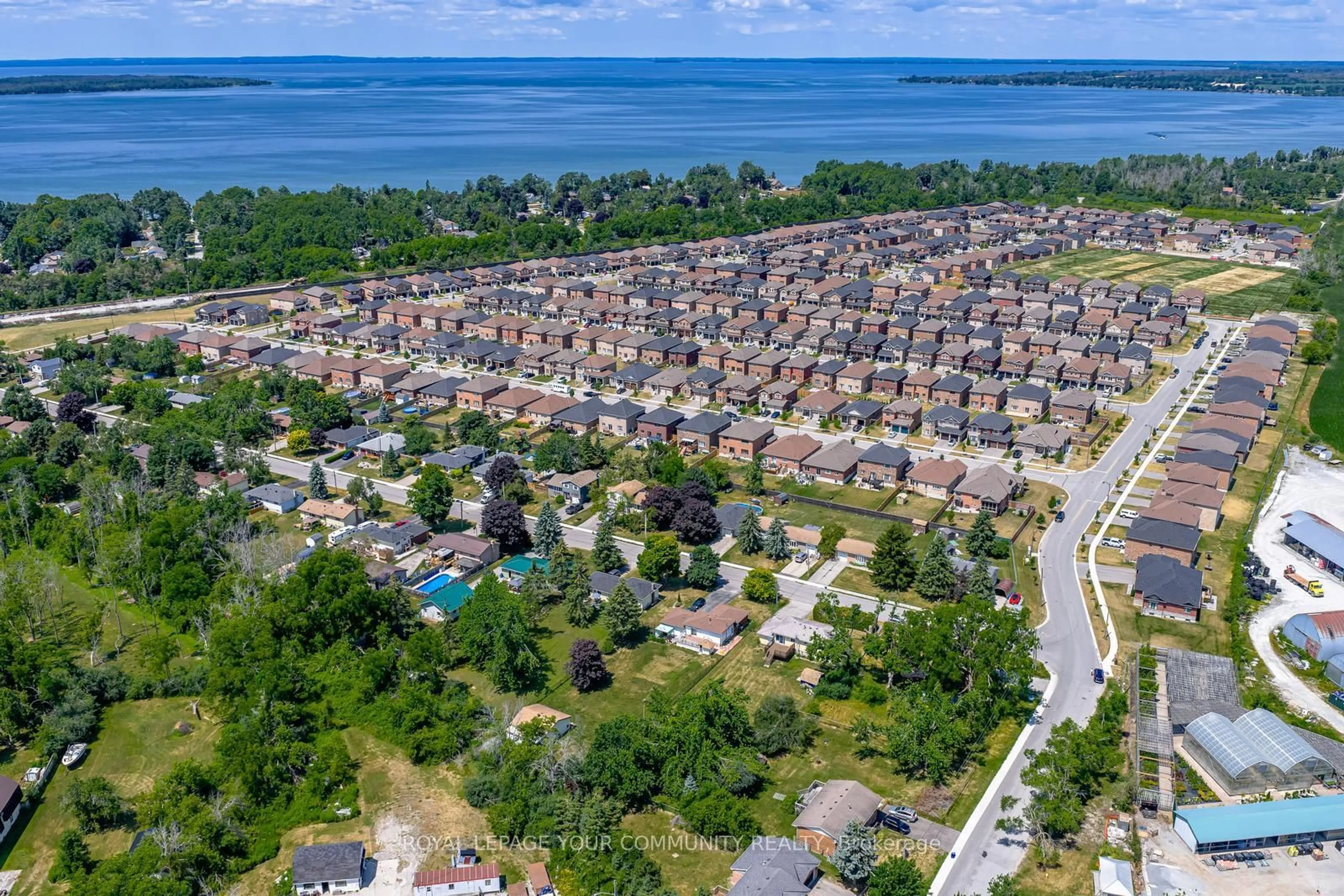 A pic from outside/outdoor area/front of a property/back of a property/a pic from drone, water/lake/river/ocean view for 347 Lakeland Cres, Brock Ontario L0K 1A0