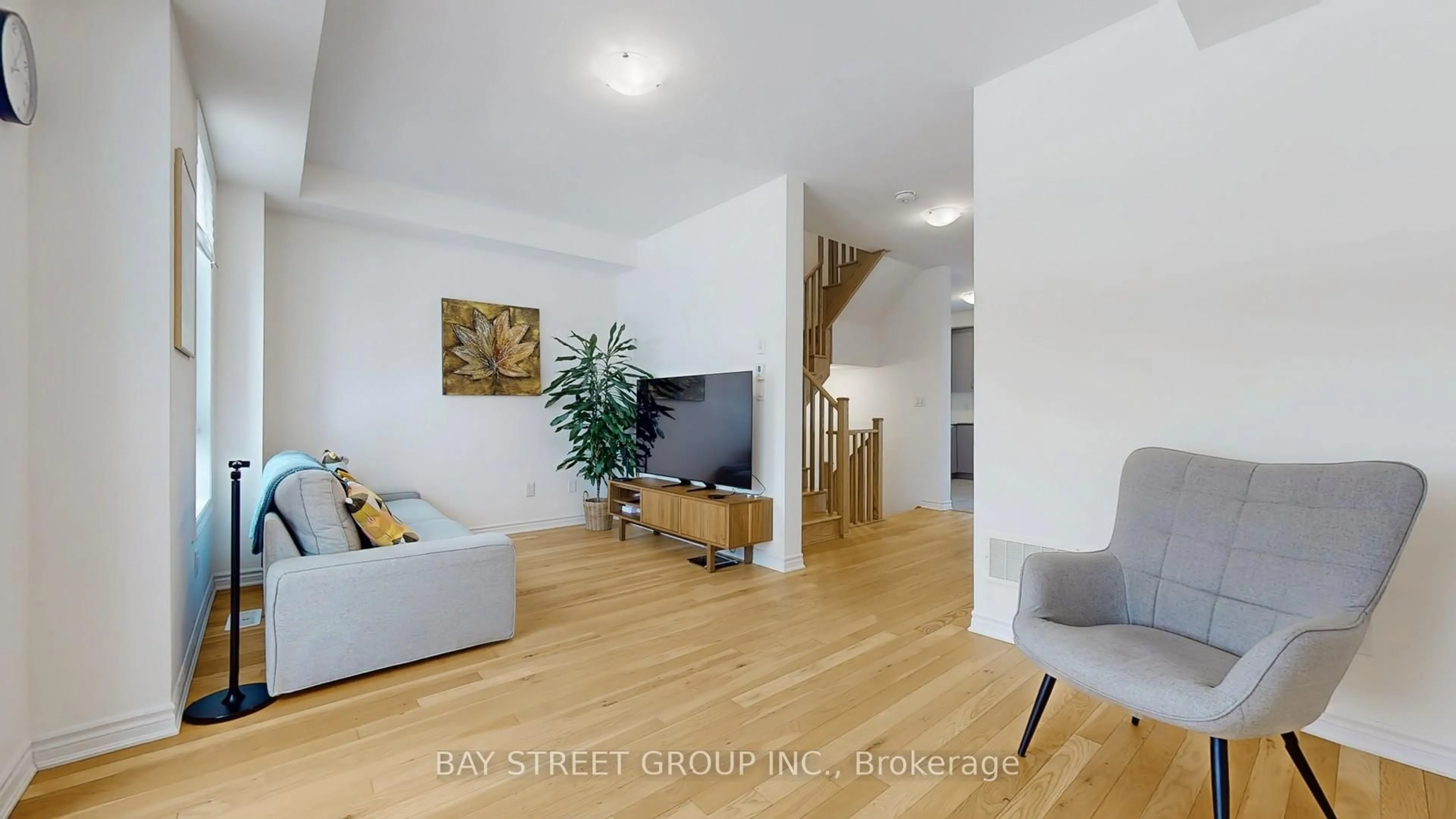 Living room with furniture, wood/laminate floor for 88 Imperial College Lane, Markham Ontario L6E 0V6